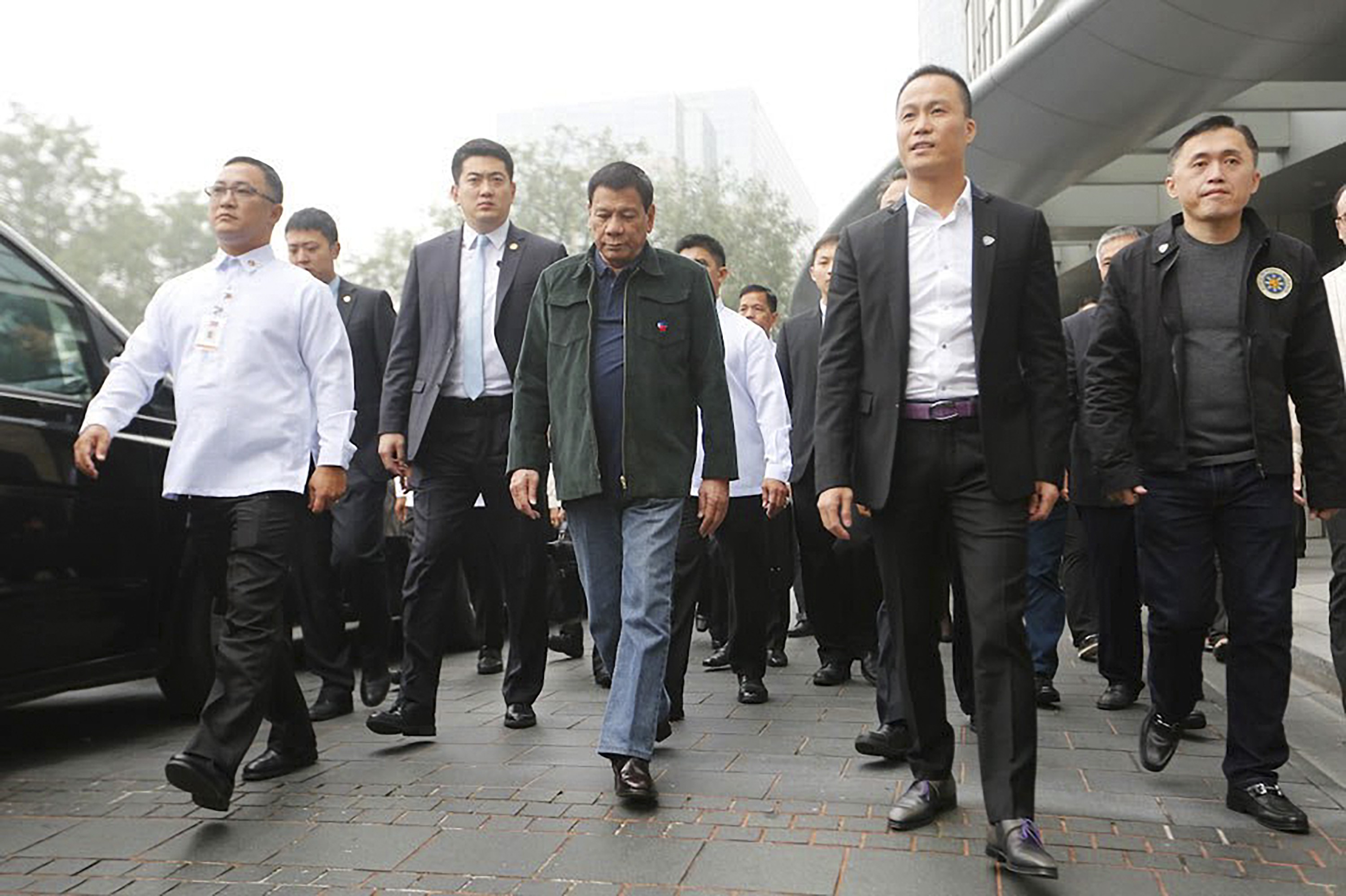 President Rodrigo Duterte accompanied by businessman Michael Yang (second right) in Beijing. Photo: Reuters