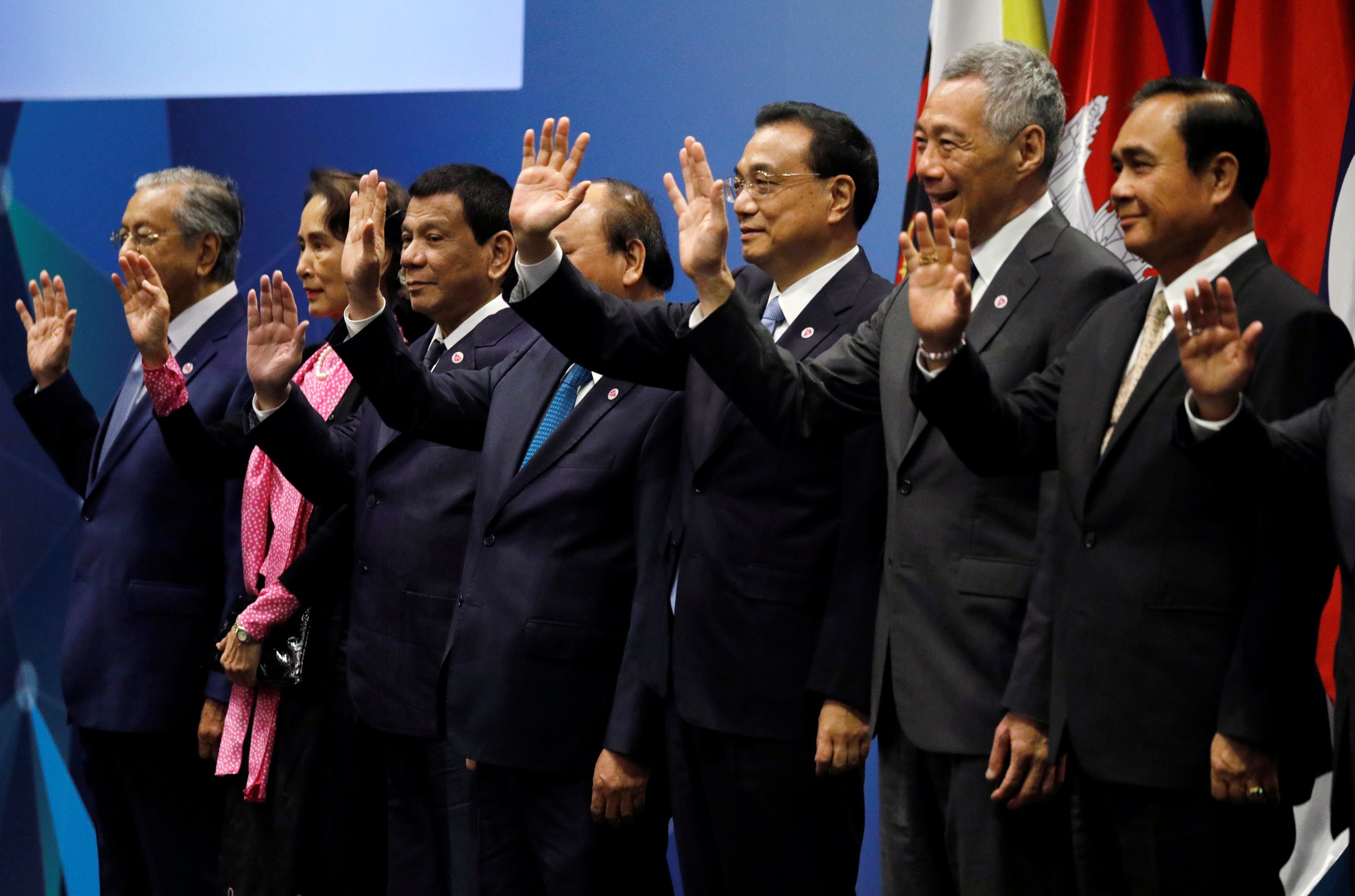 China’s Premier Li Keqiang (third from right) poses with Association of Southeast Asian Nation leaders at the Asean-China Summit in Singapore on November 14. Li signed an upgraded version of the China-Singapore free-trade agreement during his visit. Photo: Reuters