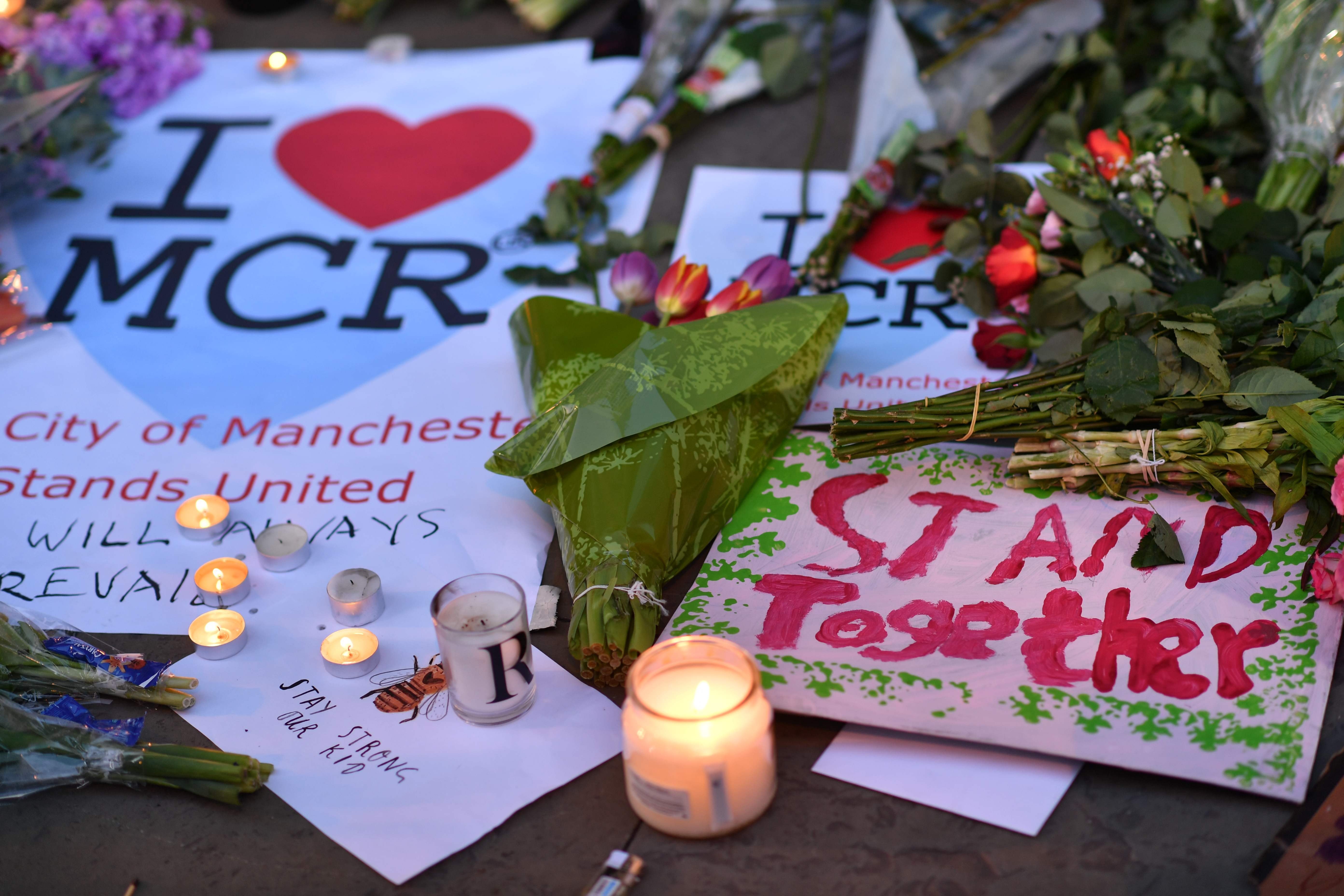 In this file photo taken on May 23, 2017 messages and floral tributes are seen in Albert Square in Manchester, northwest England, in solidarity with those killed and injured in the May 22 terror attack at the Ariana Grande concert at the Manchester Arena. Photo: AFP