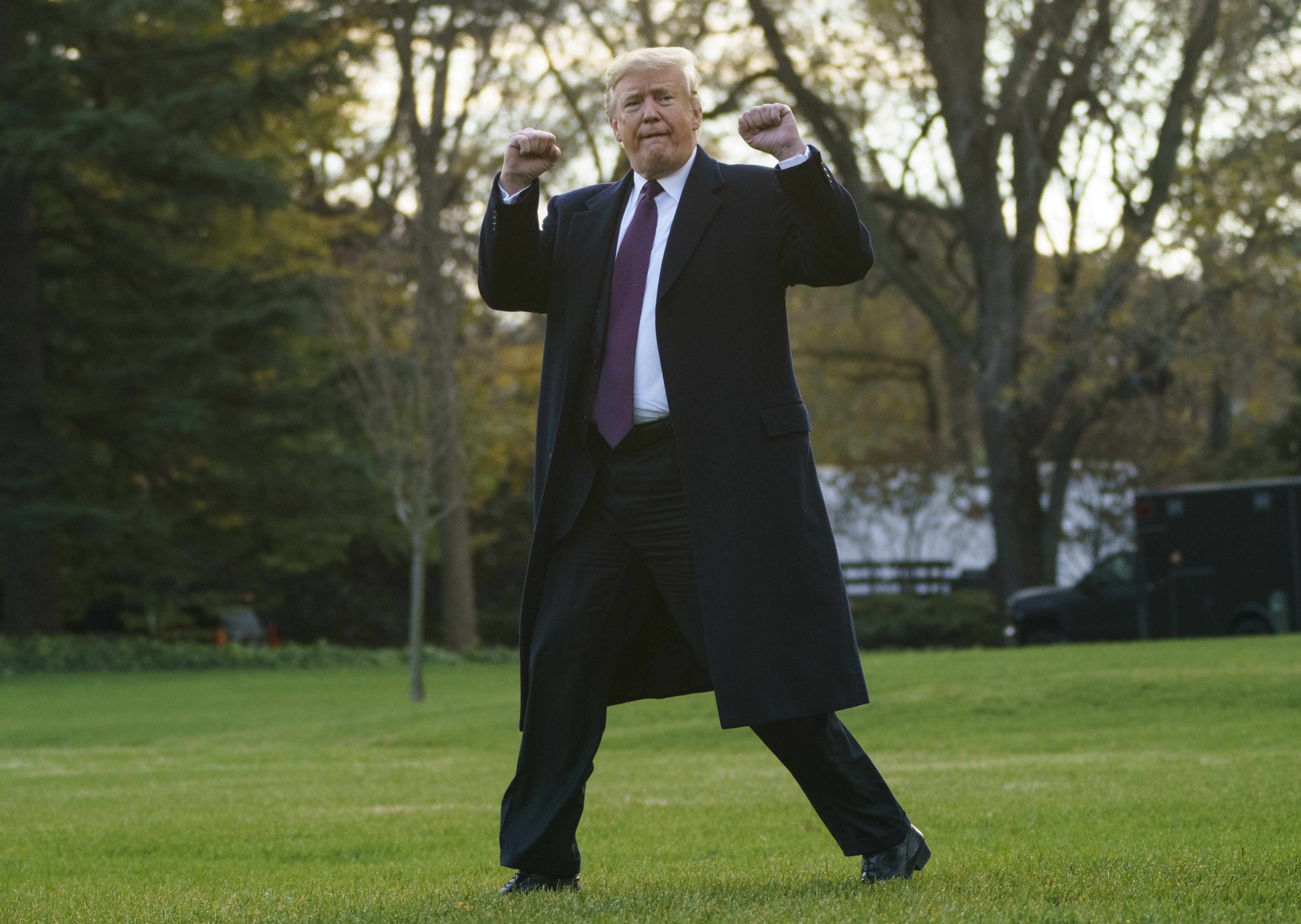 Donald Trump gestures as he walks to Marine One following a meeting with the media, at the White House on November 20. Photo: AP