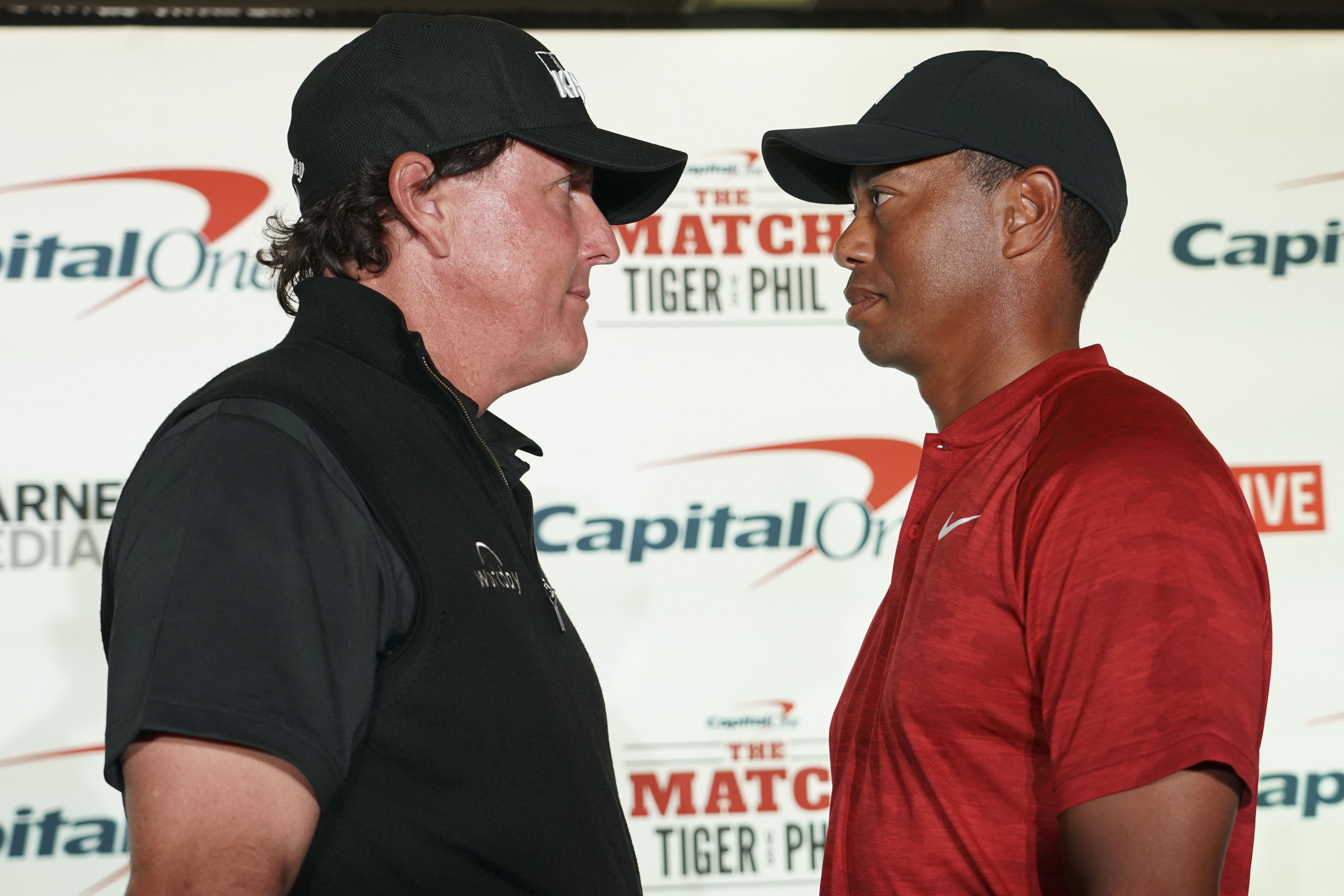 Phil Mickelson (left) and Tiger Woods. Photo: USA Today Sports