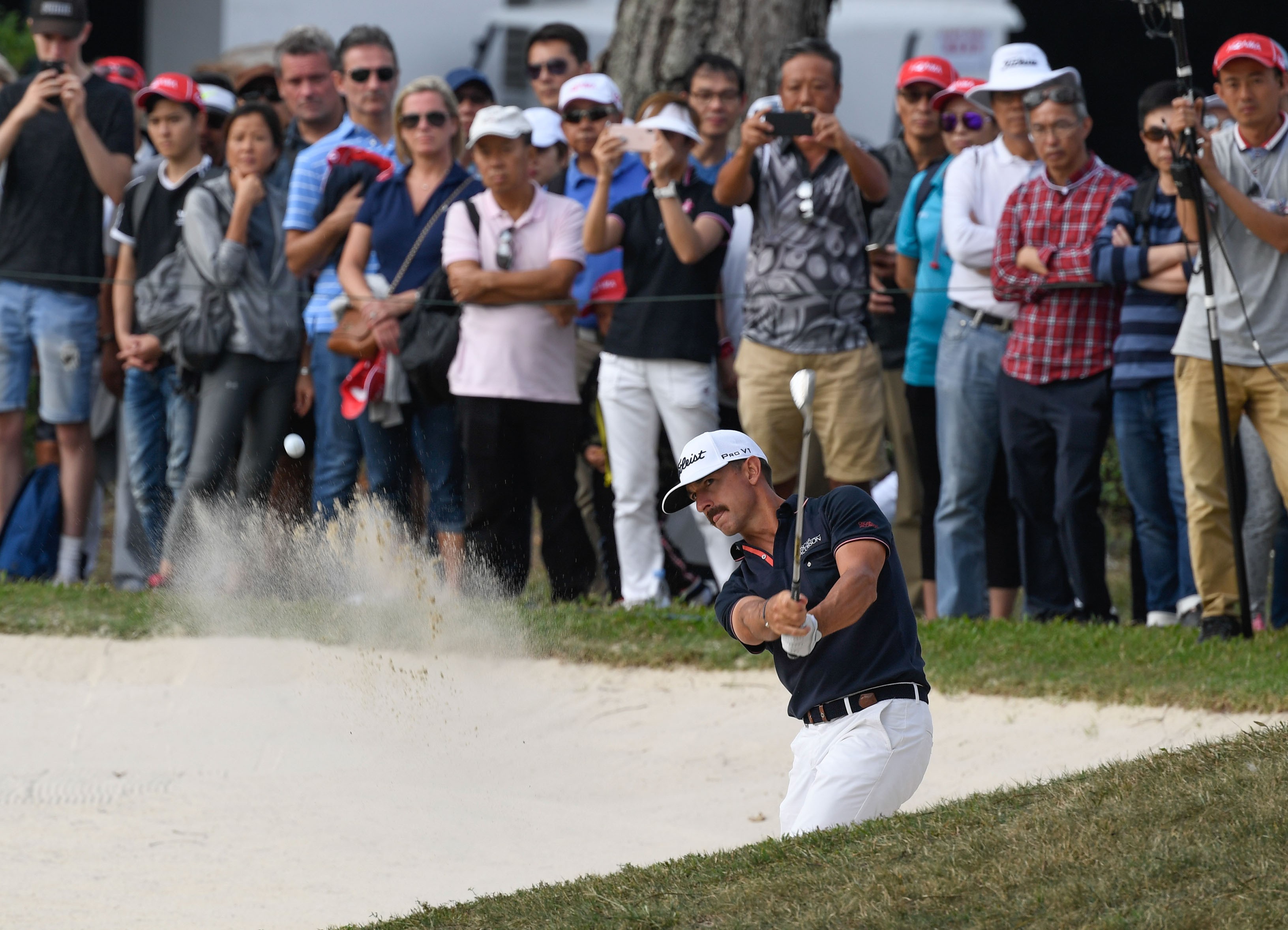 Wade Ormsby plays from the bunker at the Hong Kong Open on Saturday. Photo: Richard Castka
