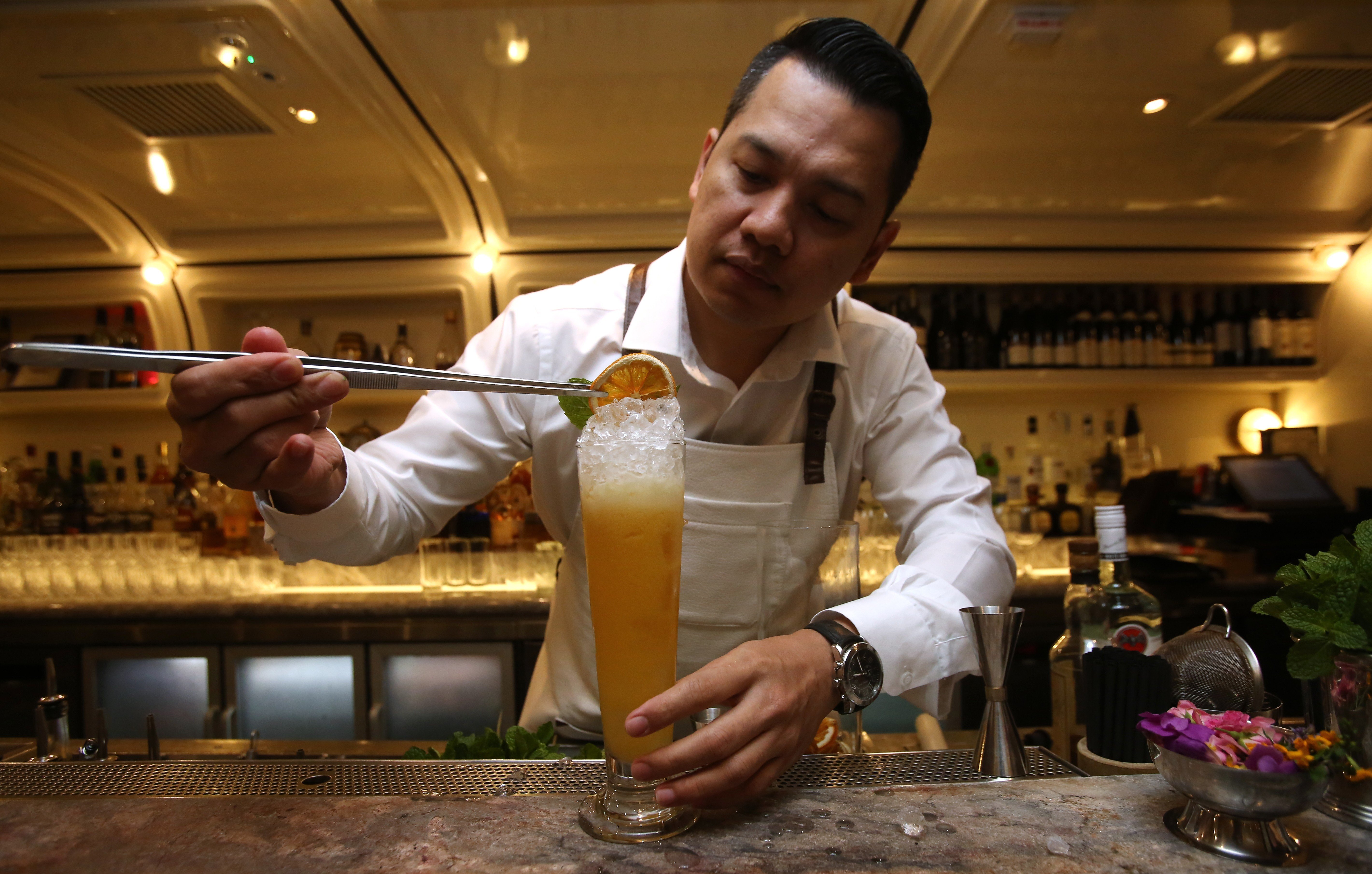Gerry Olino mixes a Hurricane Mania at Foxglove, in Central. Pictures: Jonathan Wong