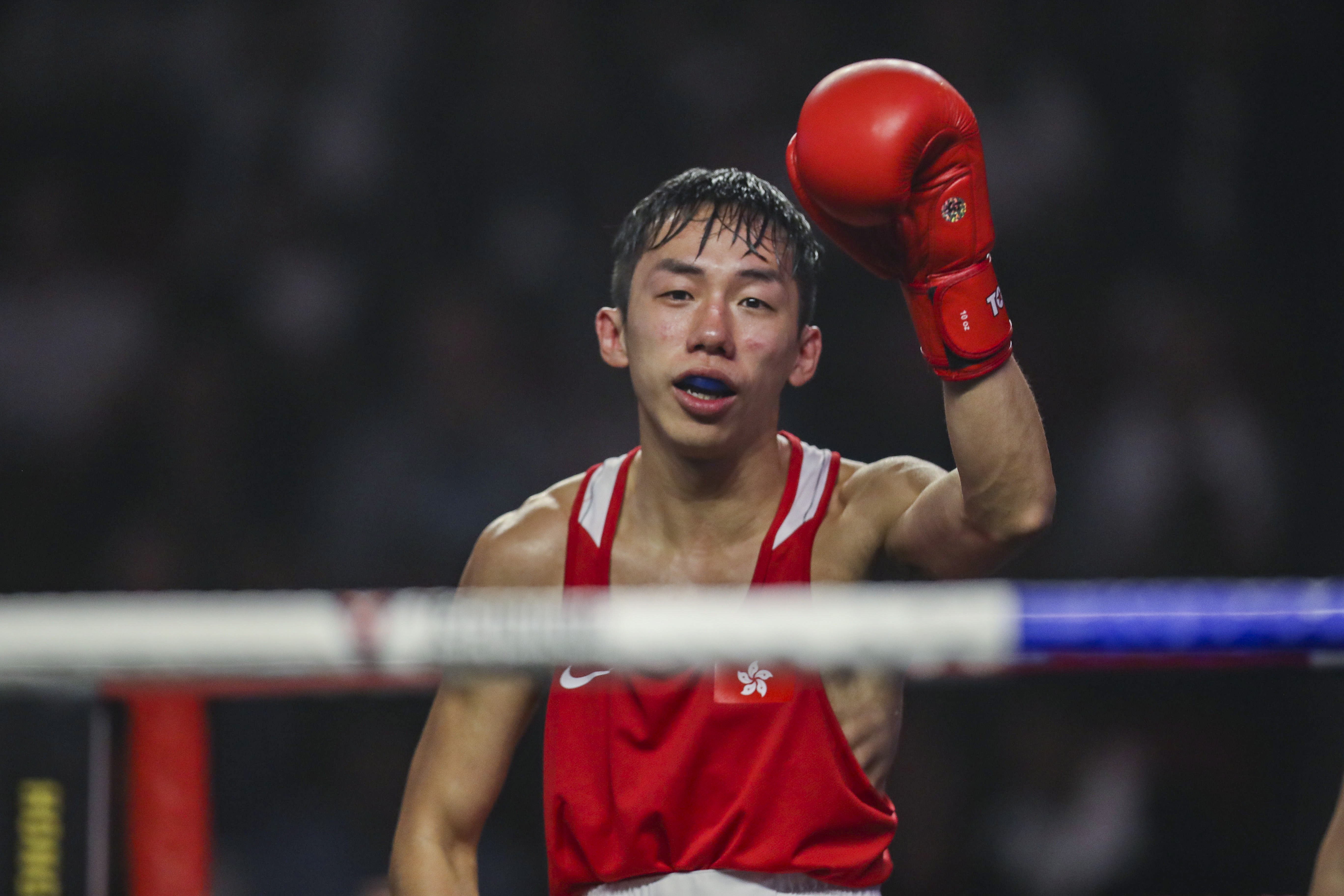 Hong Kong boxer Rex Tso raises his left fist after winning his comeback fight at Southorn Stadium. Photos: Winson Wong