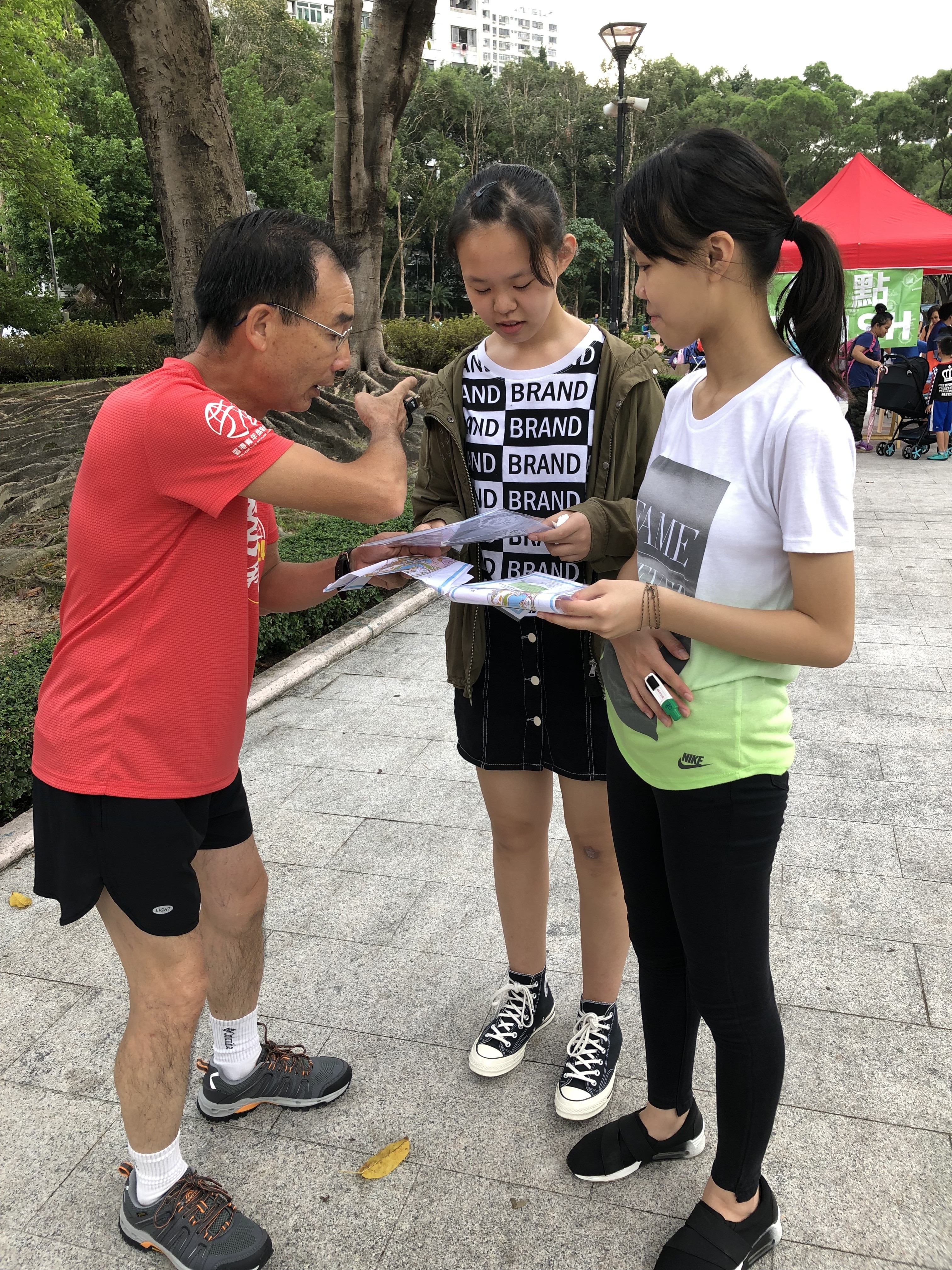 Three participants search for the correct route during the Orienteering@Park event in Tuen Mun Park, Hong Kong. Photo: Nora Tong