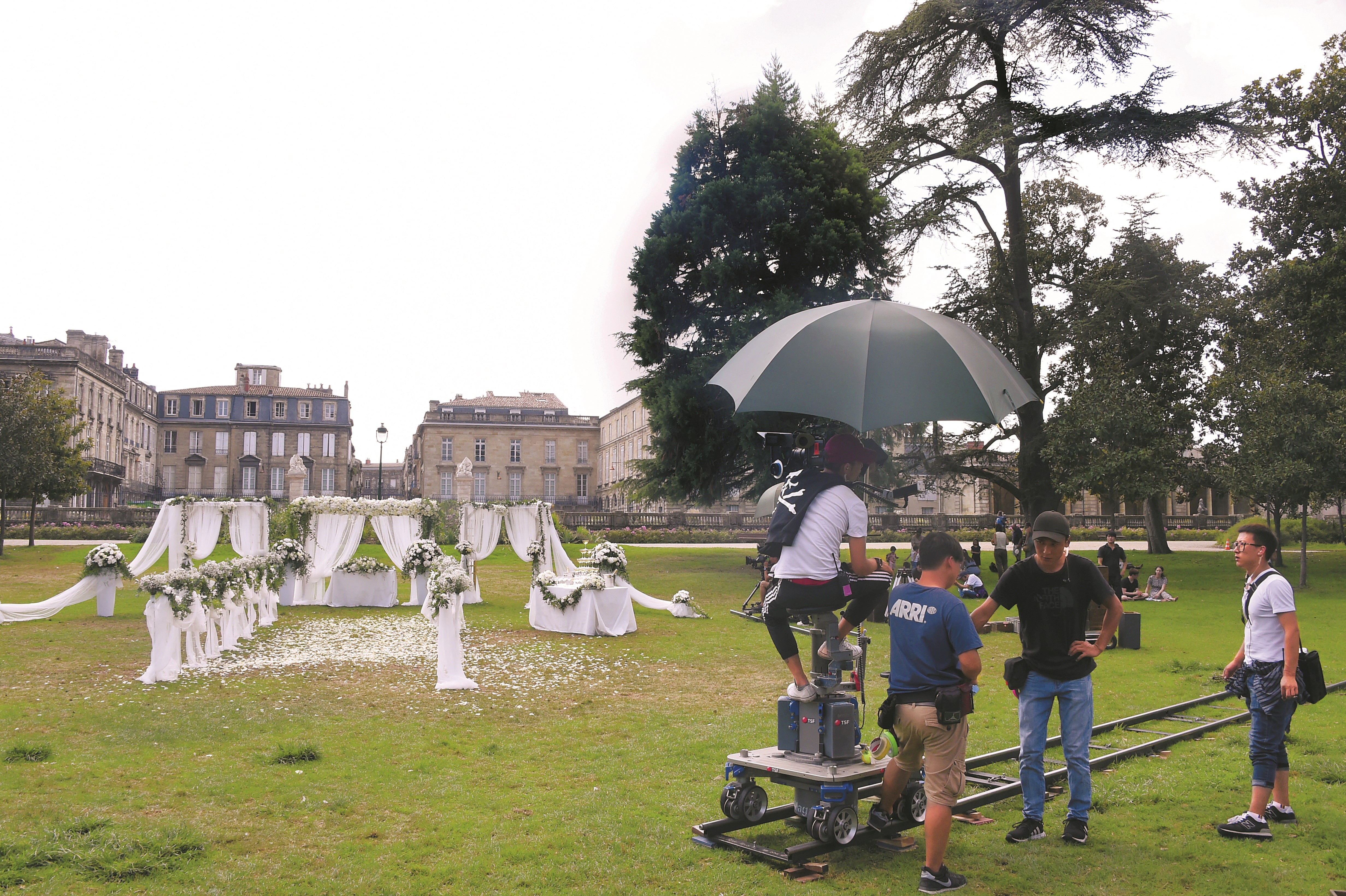 A film crew works on the Chinese TV series Crocodile and the Plover Bird in a public park in Bordeaux, western France. Photo: AFP