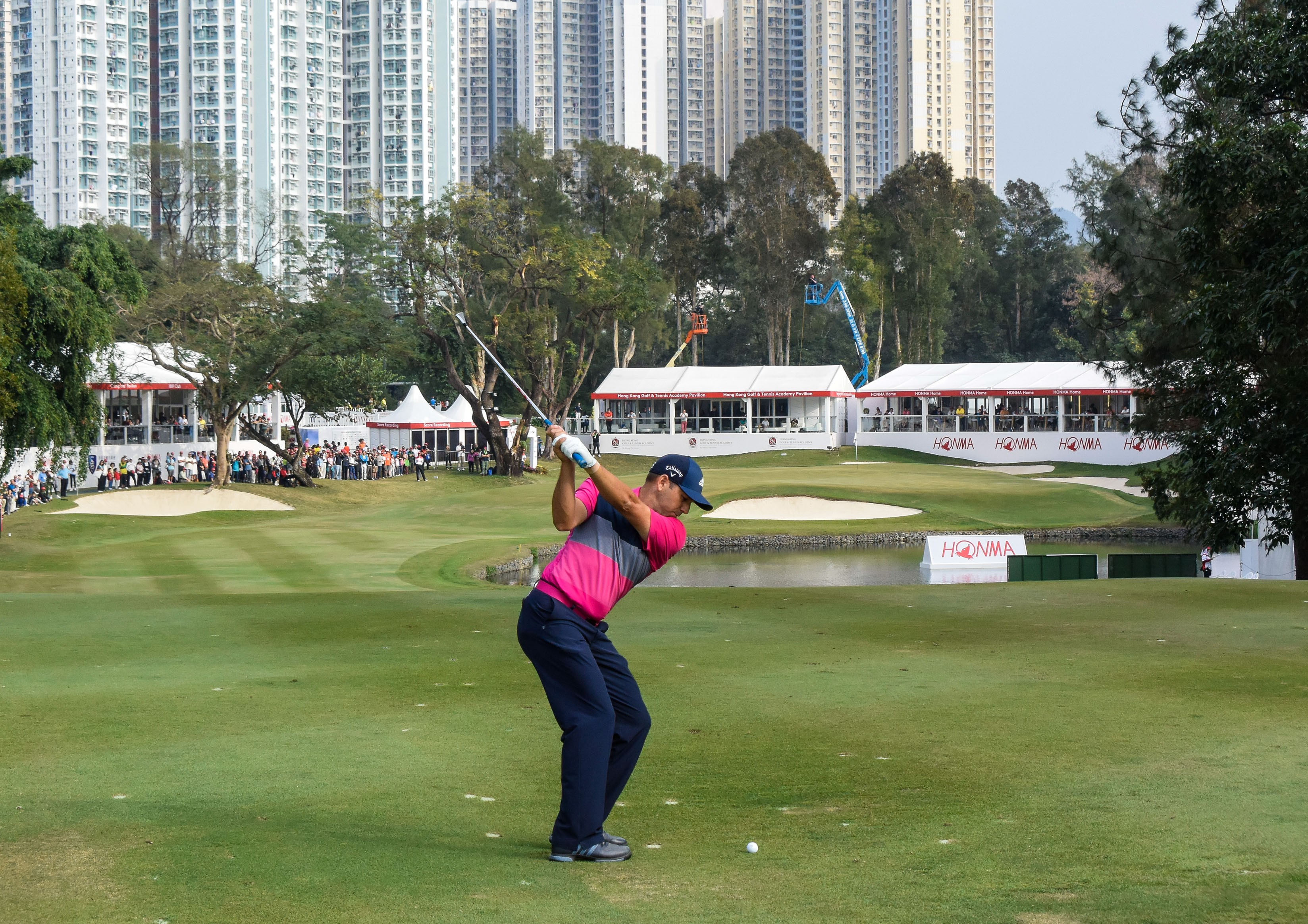 Sergio Garcia hits an approach to the 18th hole at Fanling in 2018. Photo: Richard Castka/sportpixgolf.com