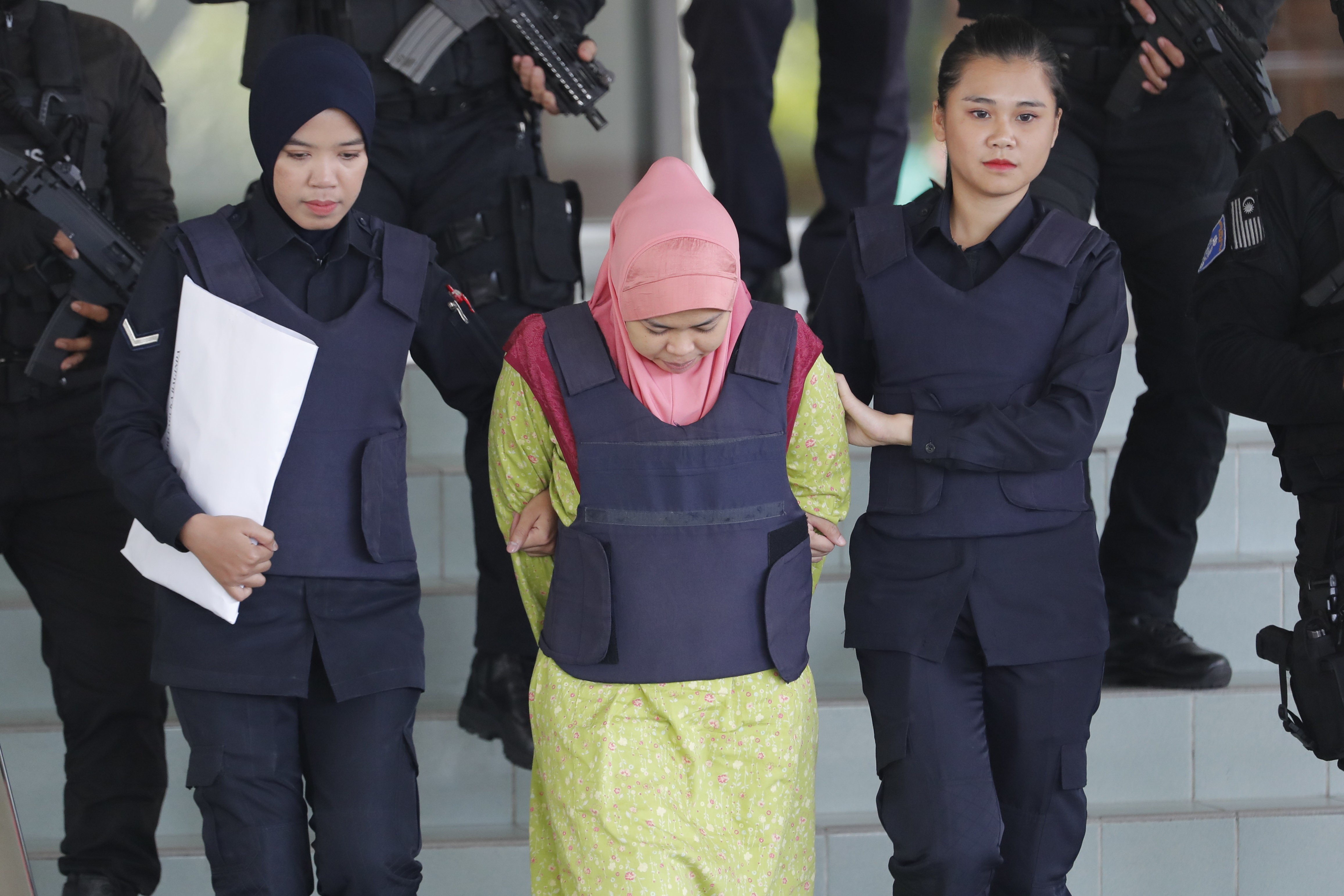 Siti Aisyah is escorted from court by Malaysian police. Photo: AP