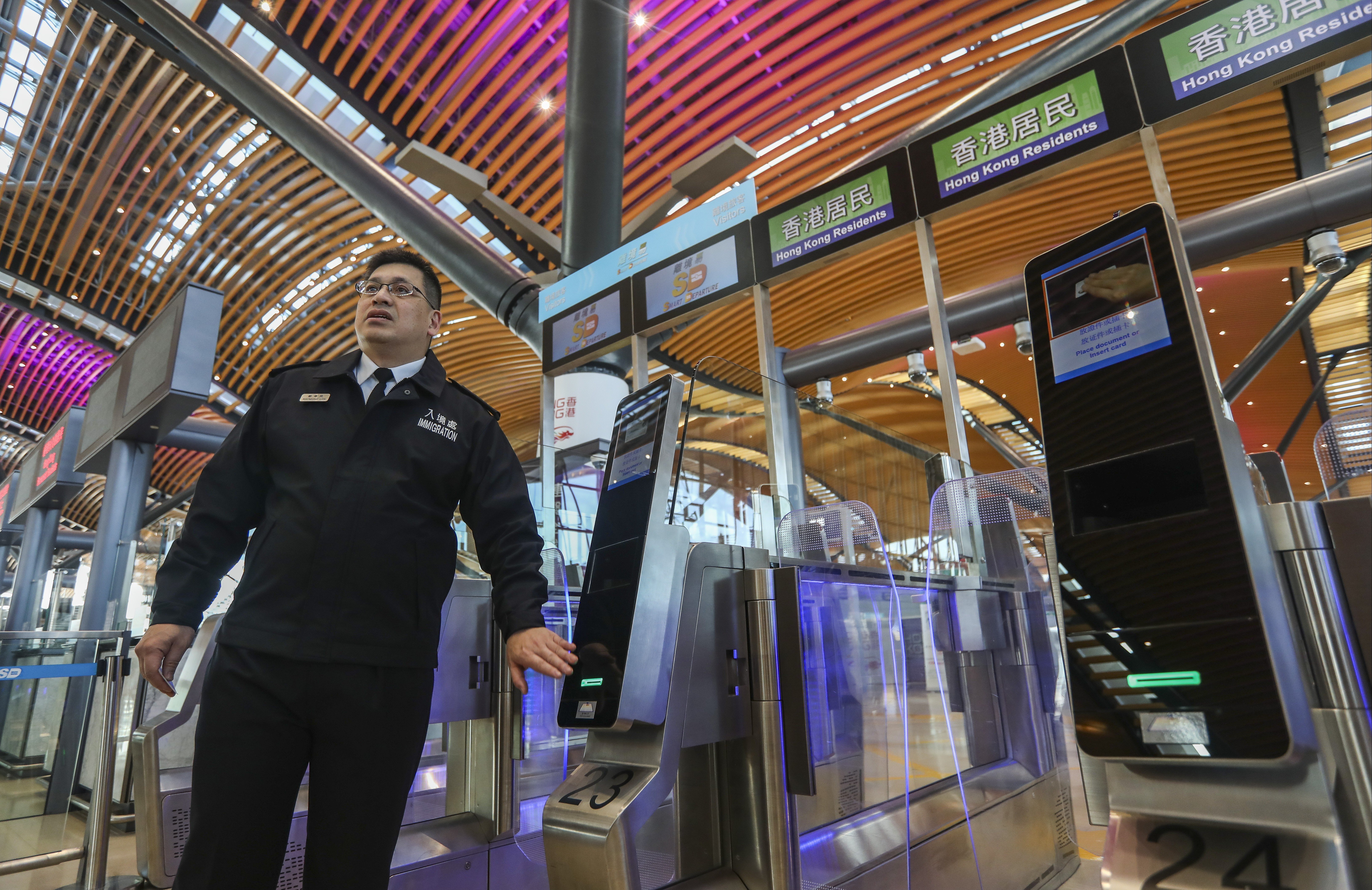 Raymond Lok, assistant director of information systems at Hong Kong Immigration demonstrates how to use the new e-channel at the customs checkpoint of the Hong Kong-Macau-Zhuhai Bridge. Photo: Xiaomei Chen