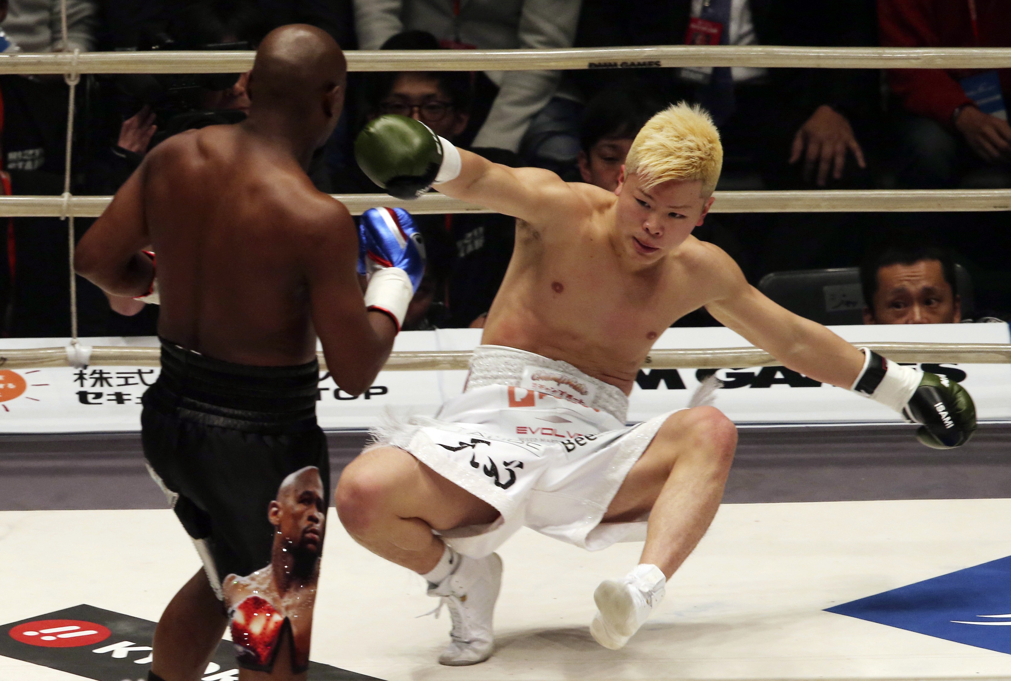 Japanese kick-boxer Tenshin Nasukawa is on his way to the canvas after being hit by Floyd Mayweather Jnr in their exhibition fight in Saitama. Photo: AP