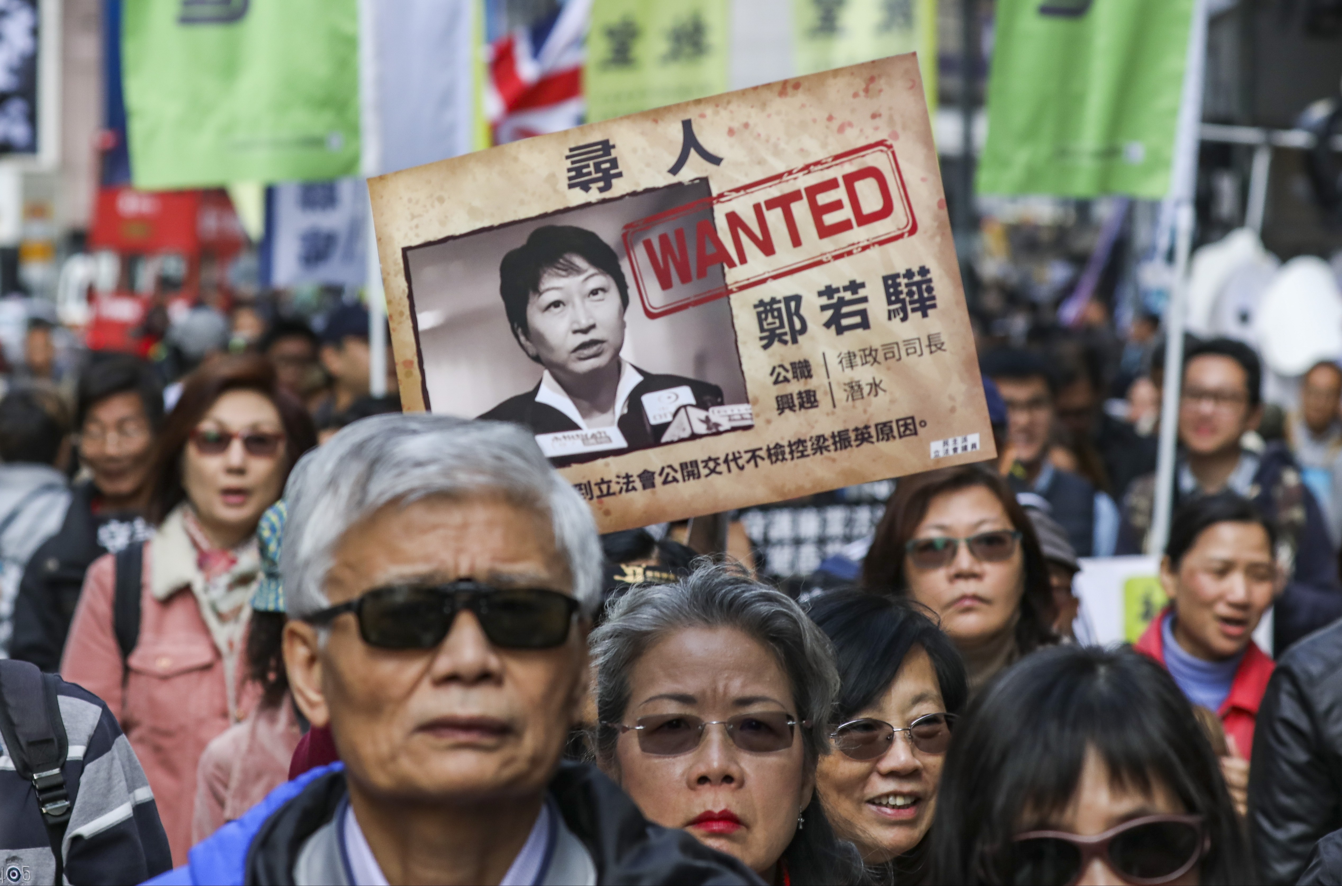 Protesters express discontent over Secretary for Justice Teresa Cheng’s handling of the C.Y. Leung-UGL payment case, as the annual New Year rally crosses Causeway Bay. Photo: Nora Tam