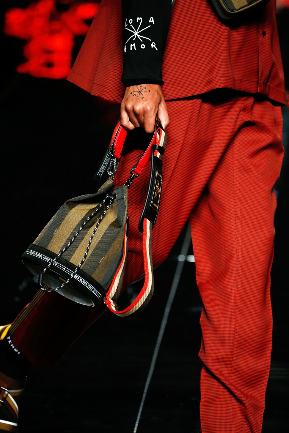 Gentlemen, jealous of your beloved's Fendi bucket bag? Here's one