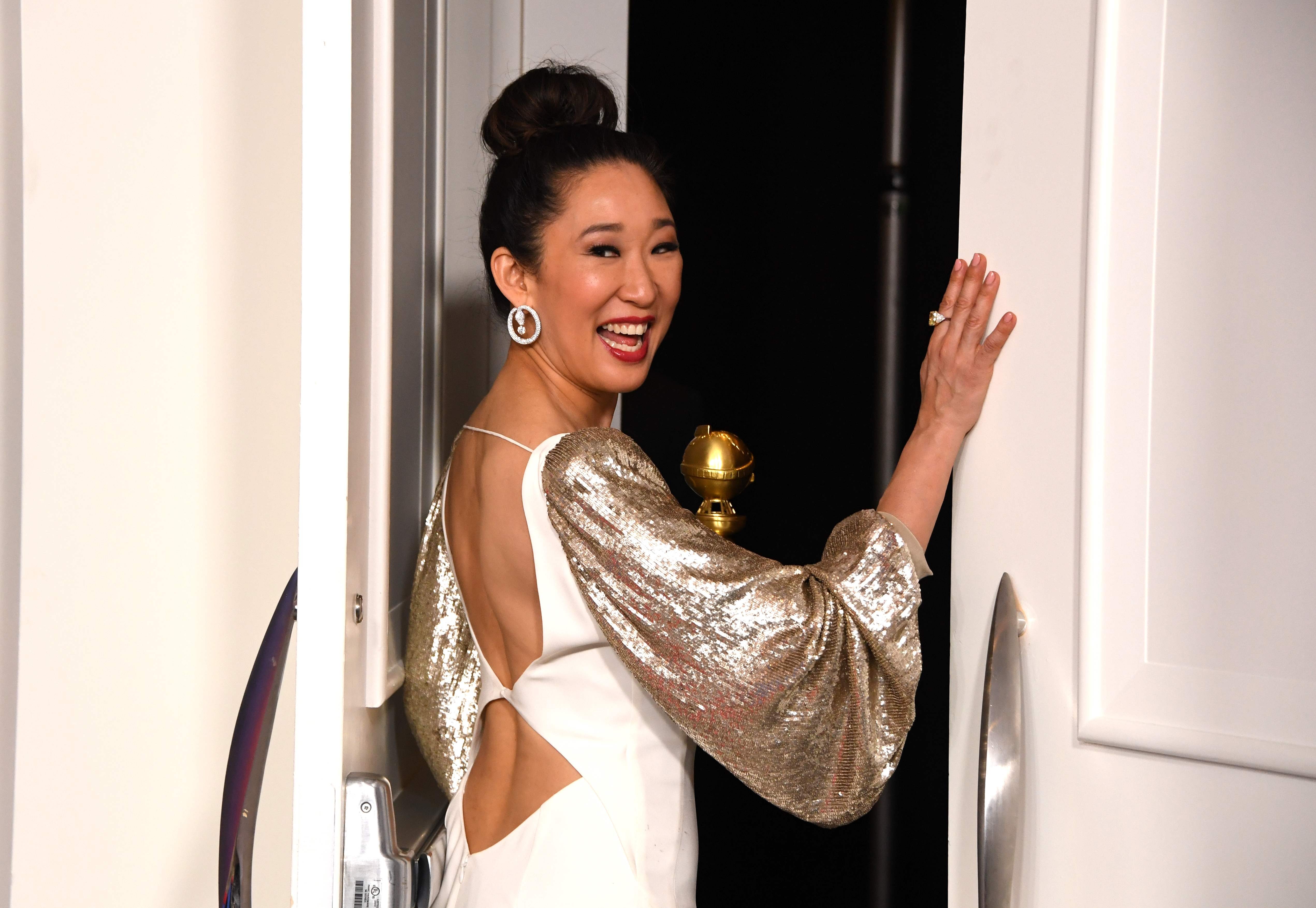 Golden Globes host Sandra Oh poses with her own trophy for best actress in a television drama for her role in ‘Killing Eve’ at the 76th annual Golden Globes in Beverly Hills, California. Photo: AFP