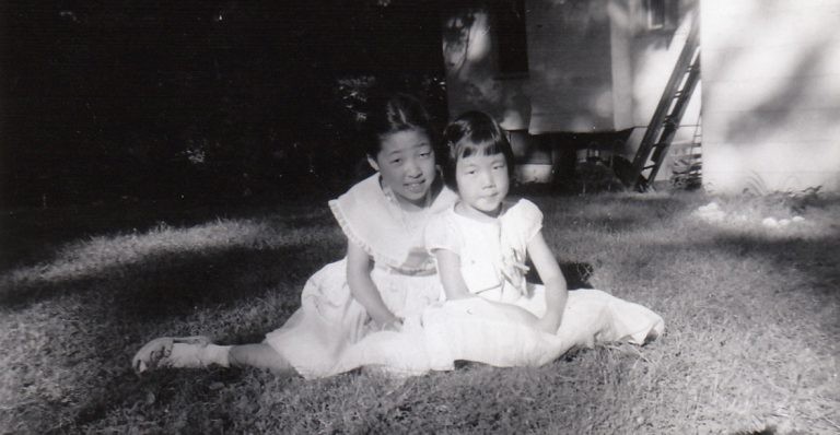 Eugenia Kim (right), author of The Kinship of secrets, with her sister Sun, in 1958. Picture: courtesy of Eugenia Kim
