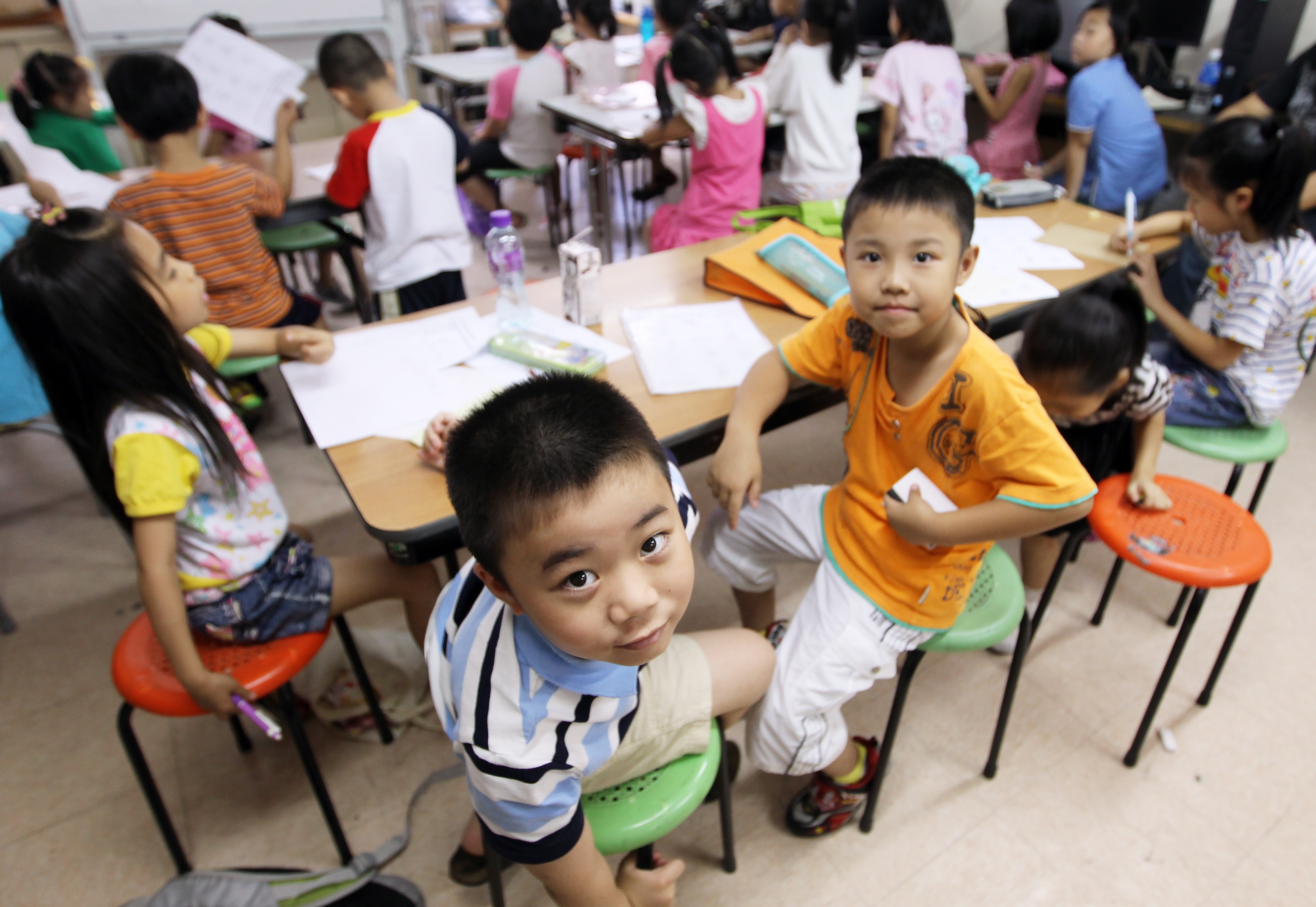 Home-alone children learning English at a childcare centre in Sham Shui Po. The government’s move to improve childcare services is commendable, but its proposed measures won’t effectively facilitate child development. Photo: Edward Wong