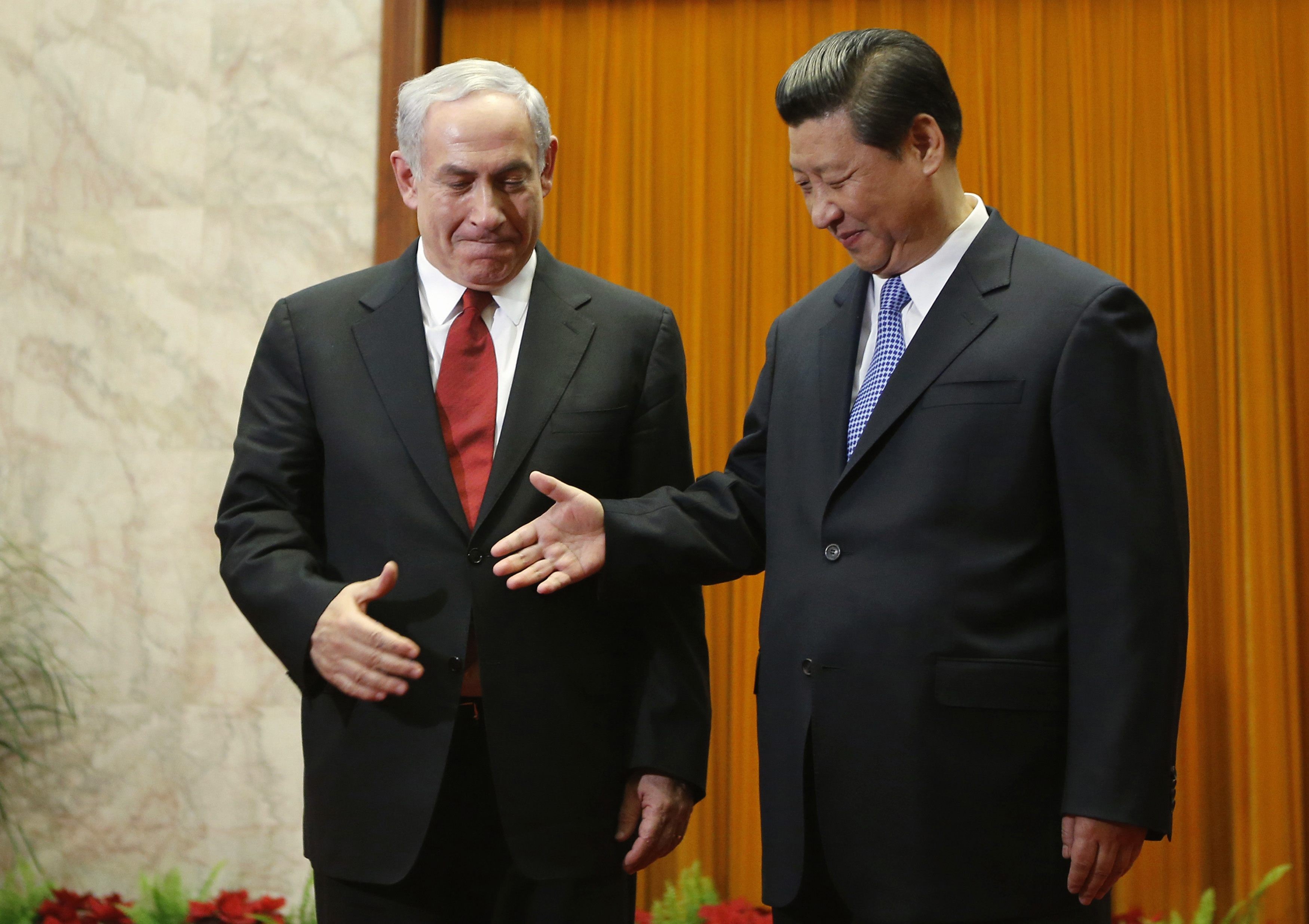 Israel's Prime Minister Benjamin Netanyahu shakes hands with China's President Xi Jinping at the Great Hall of the People in Beijing, in 2013. Photo: Reuters