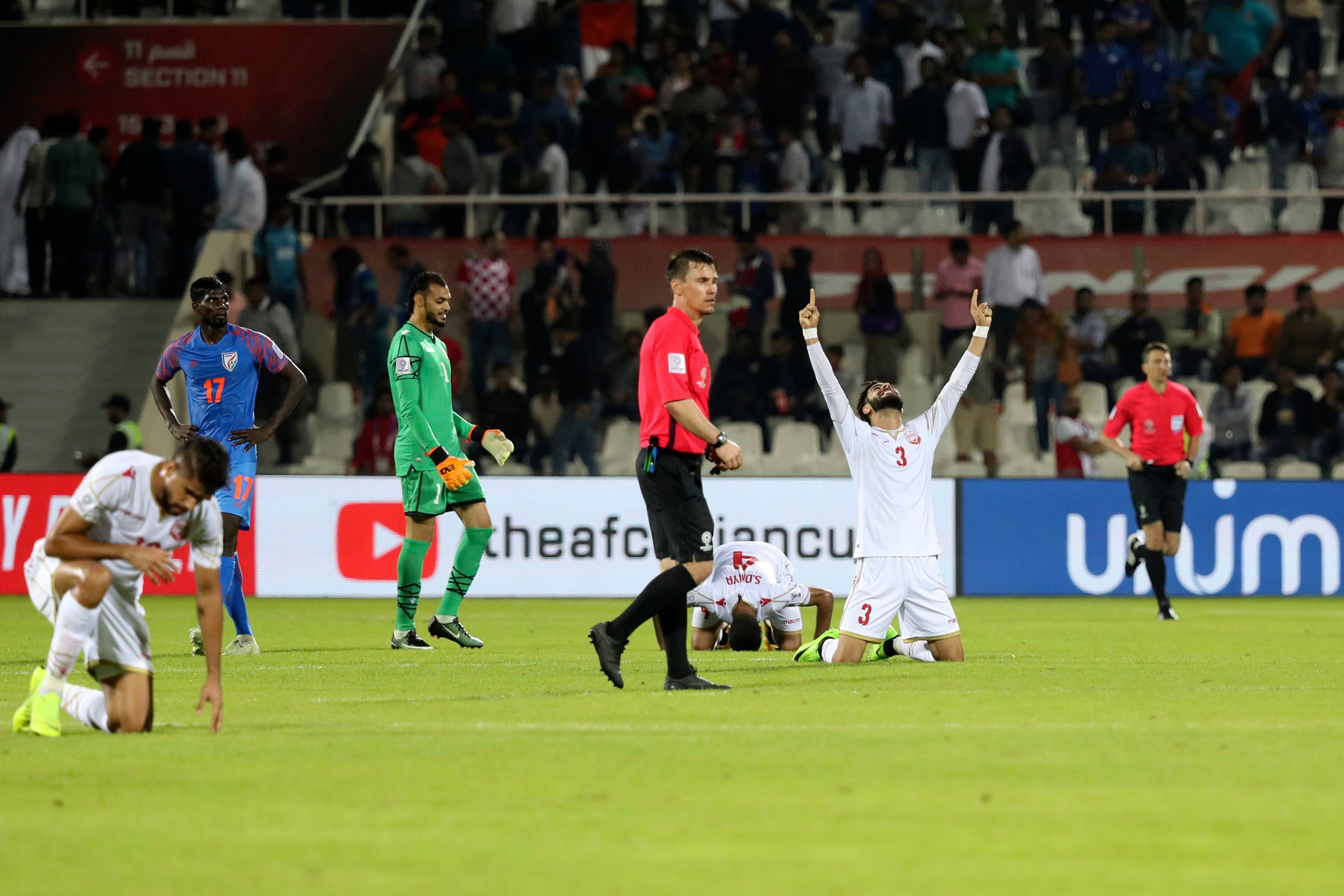 Bahrain defender Waleed Al Hayam (right) celebrates after winning the 2019 AFC Asian Cup group A football match against India. Photo: AFP