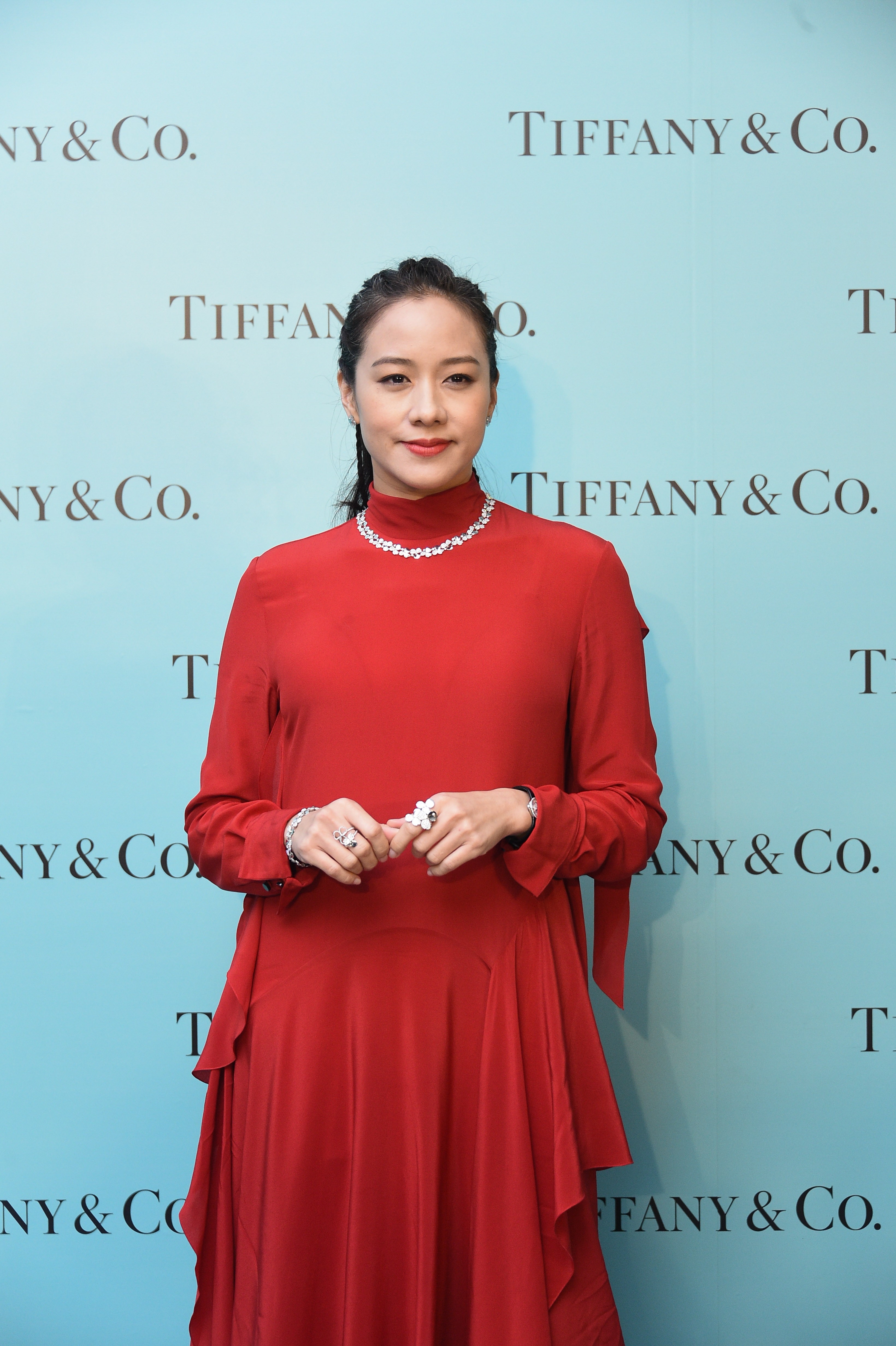 Karena Lam looks festive in red at Tiffany’s waterfront party.