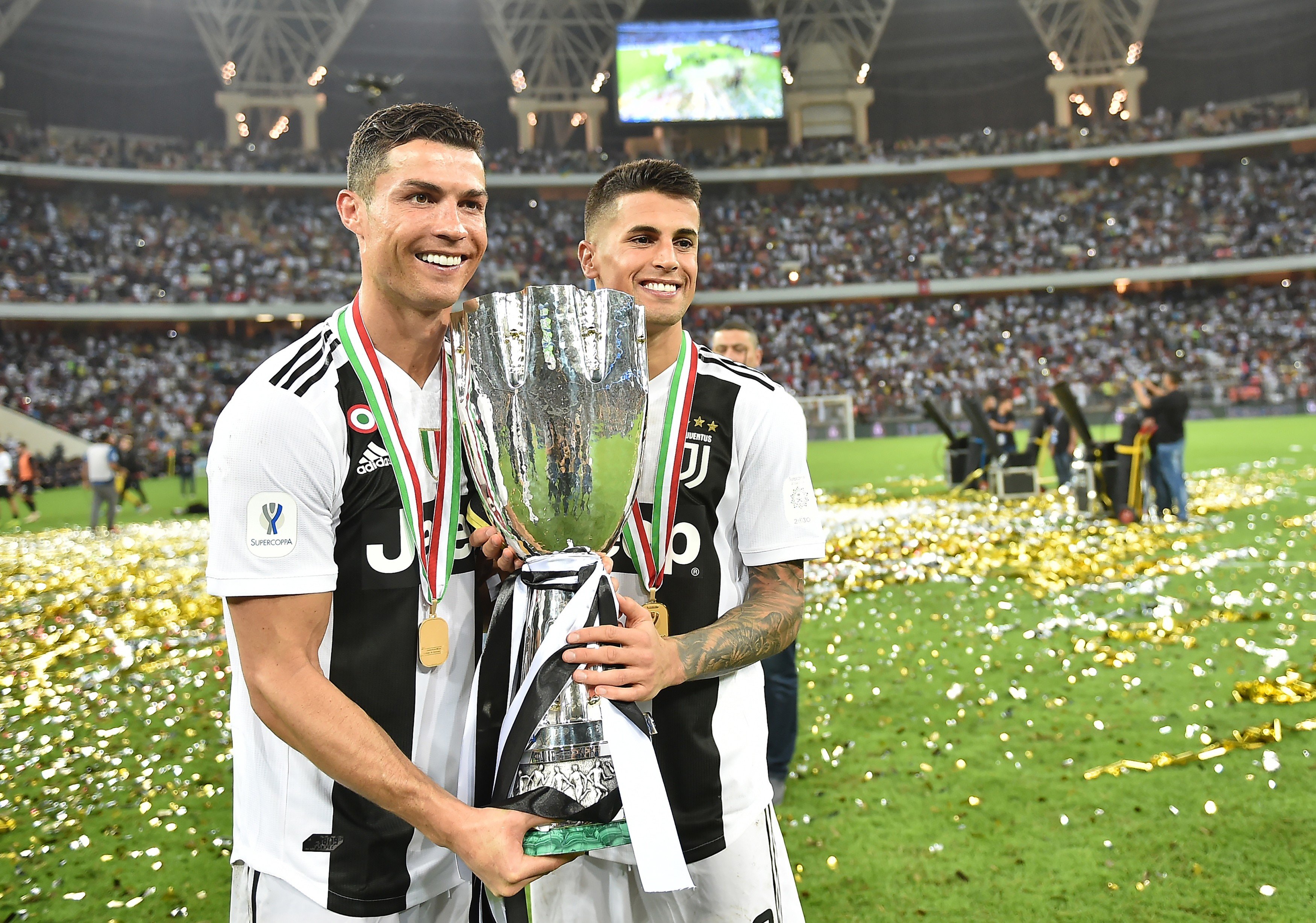 Juventus stars Cristiano Ronaldo (left) and Argentine forward Paulo Dybala celebrate with the Supercoppa trophy. Photo: EPA