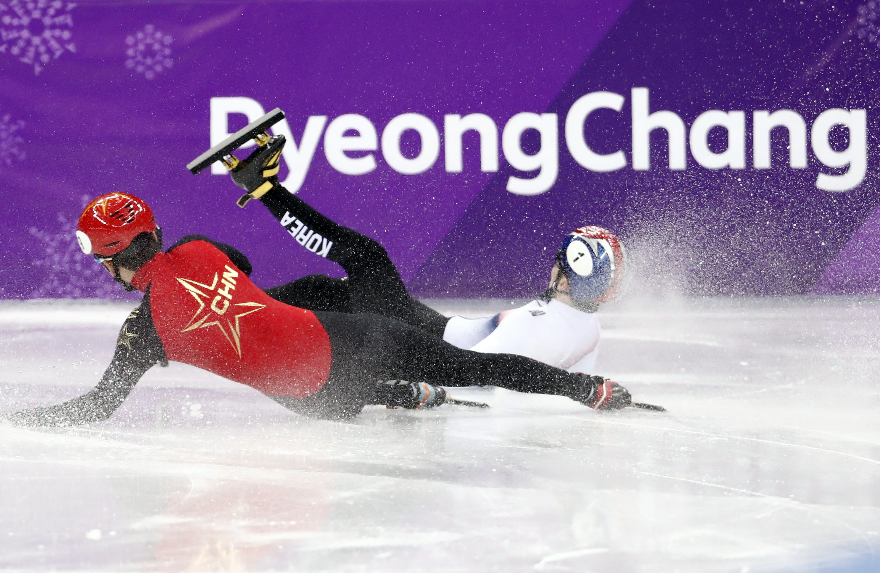 Two short-track speedskaters crash at the 2018 Winter Olympics in Pyeongchang. Photo: Reuters
