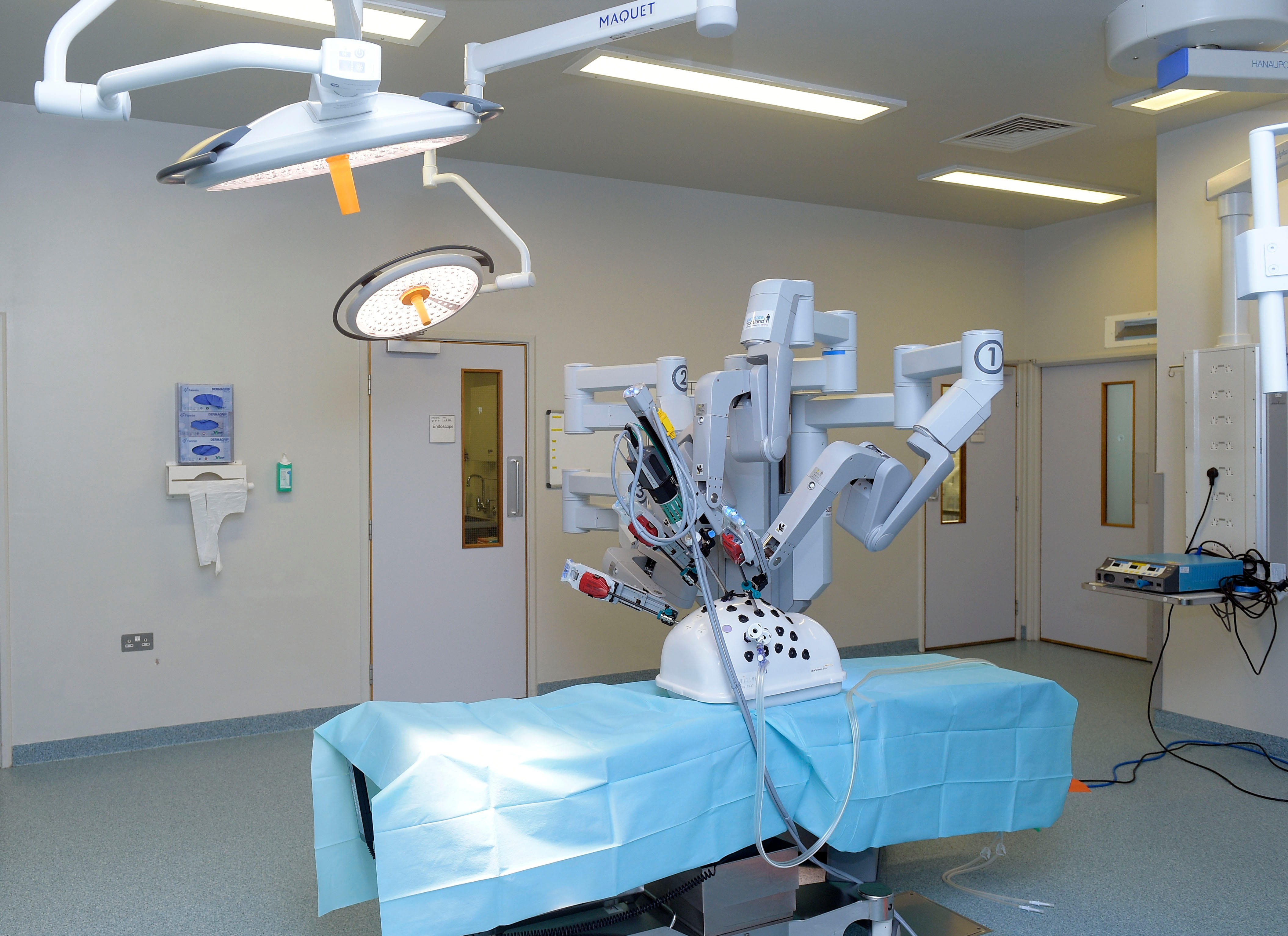 The da Vinci surgical system is the first FDA-approved system that involves devices using tele-manipulation of articulating arms operated by a surgeon sitting at a console with video monitor and joystick/pedal controls. Photo: Alamy