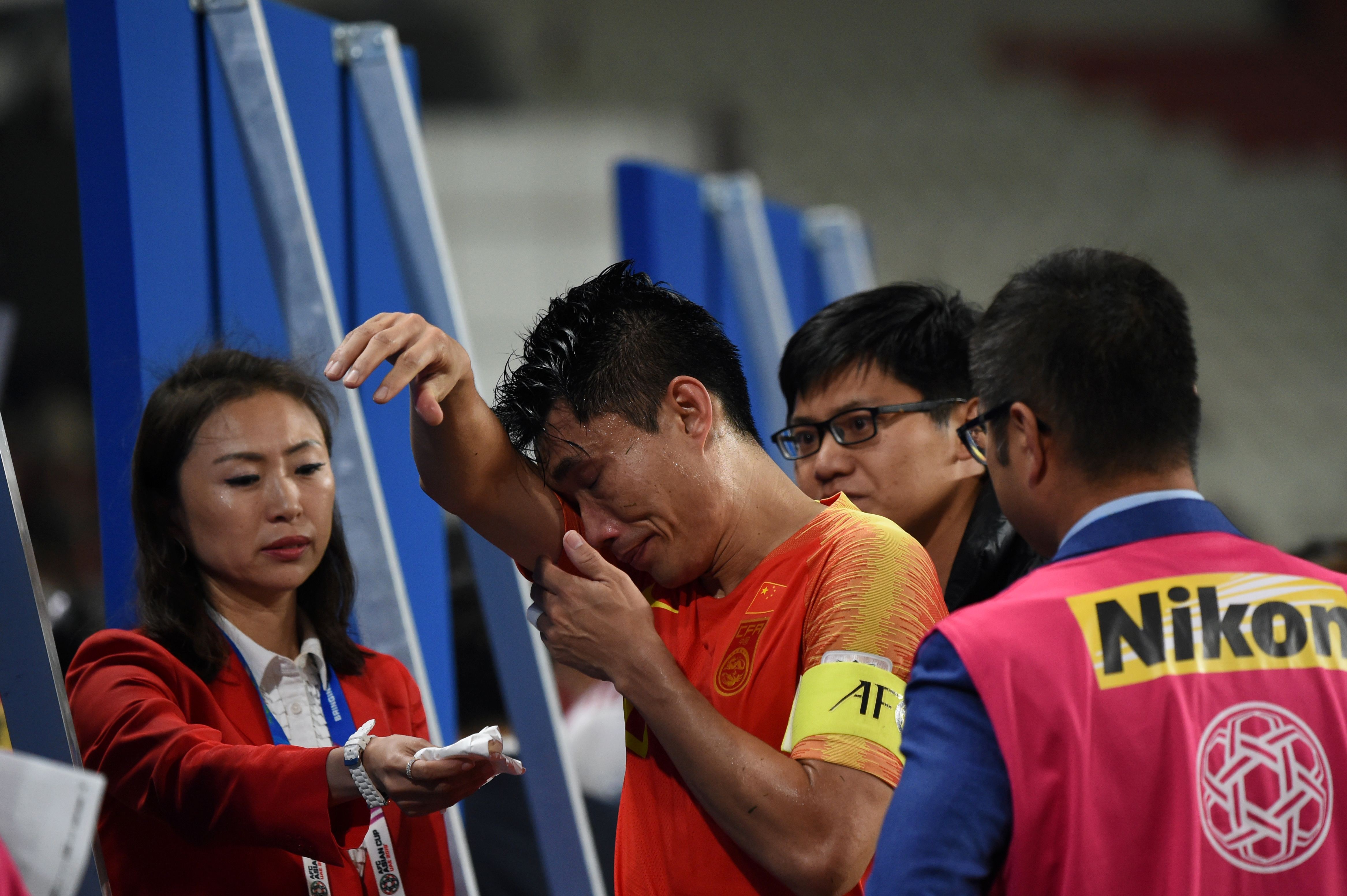 China midfielder Zhi Zheng is in tears after China’s Asian Cup quarter-final exit. Photo: AFP