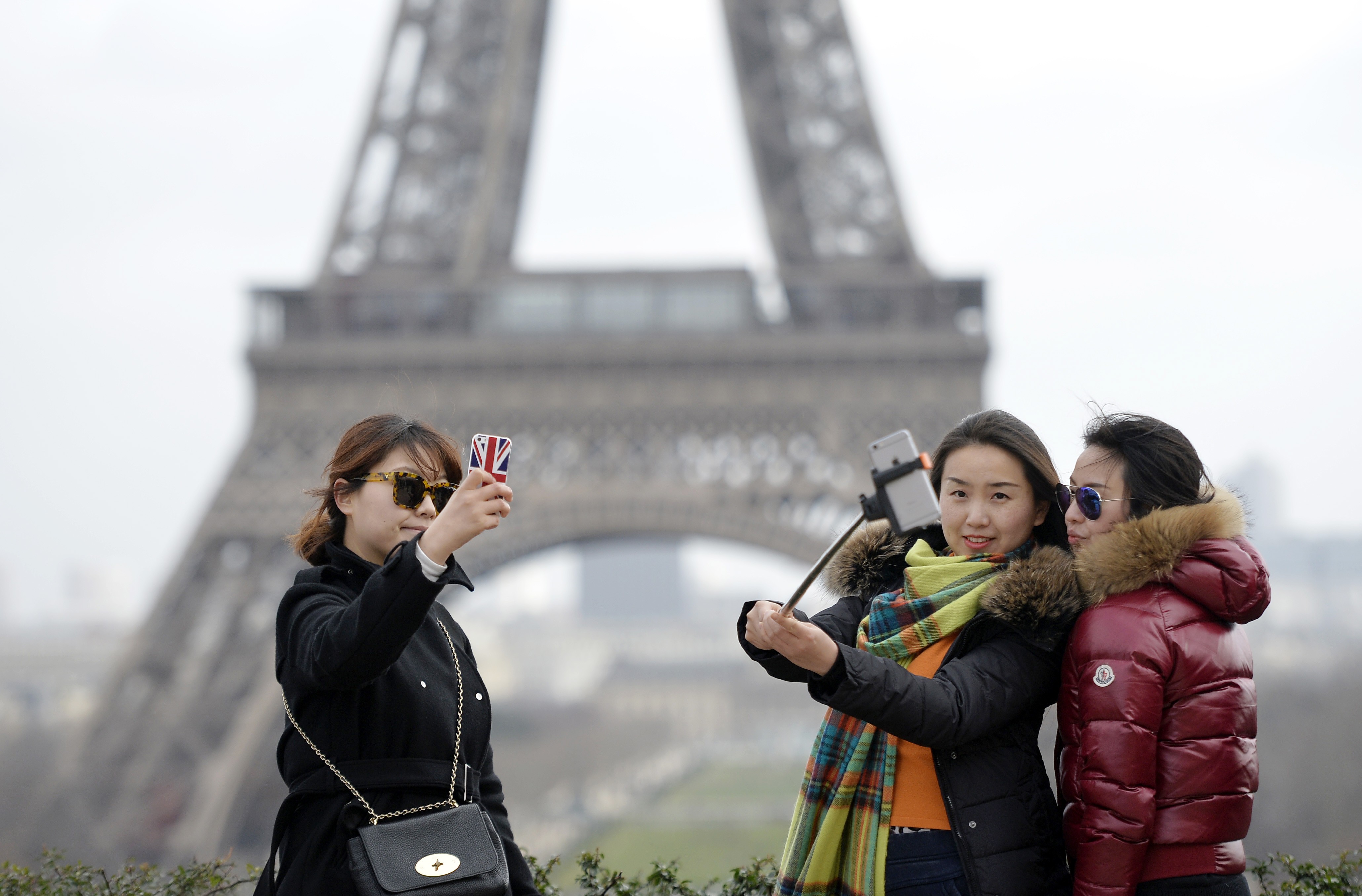 Chinese tourists in front of the Eiffel Tower in Paris. Photo: AFP