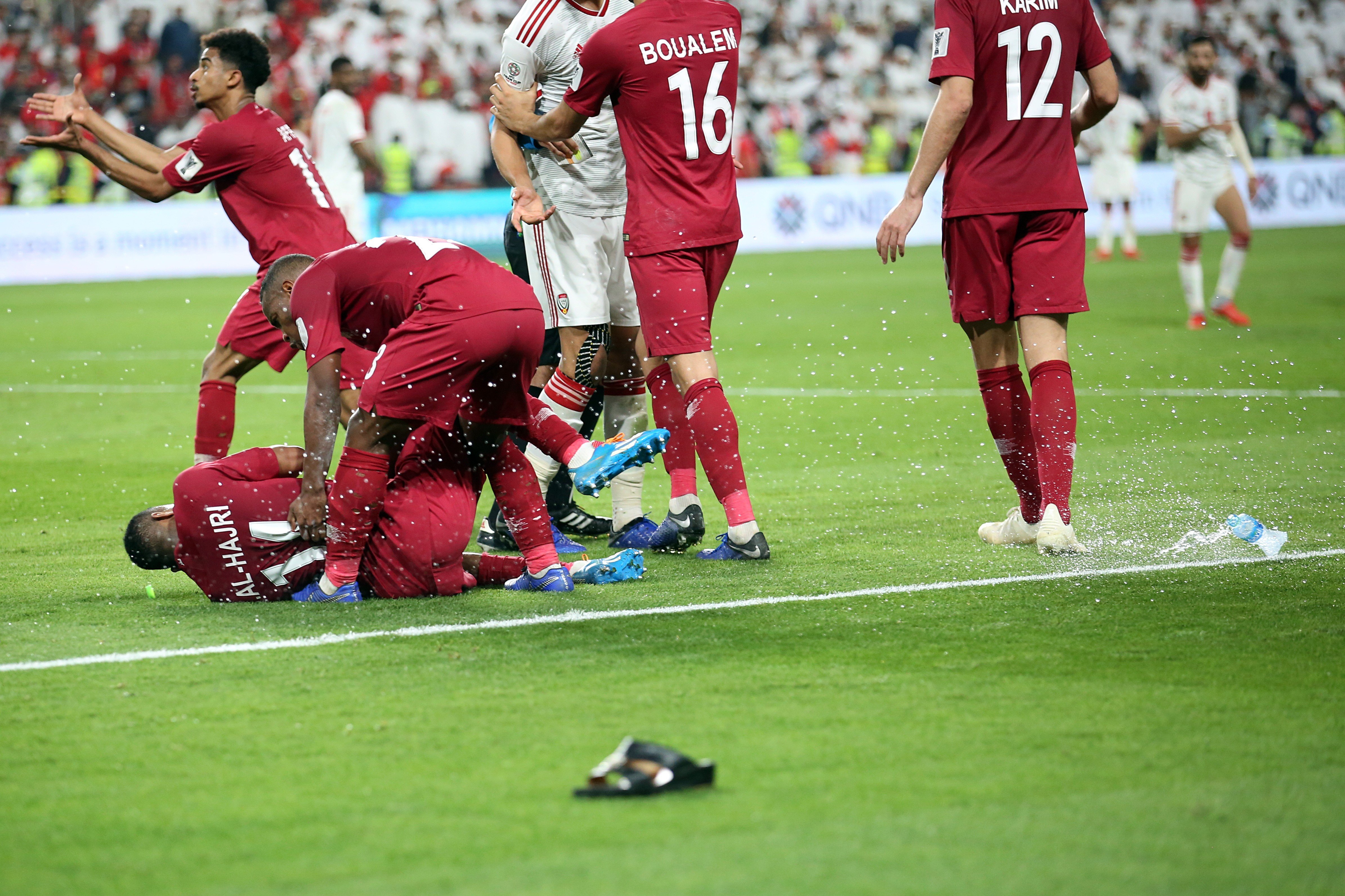UAE fans throw bottles and flip-flops during the AFC Asian Cup semi-final match against Qatar in Abu Dhabi. Photo: EPA