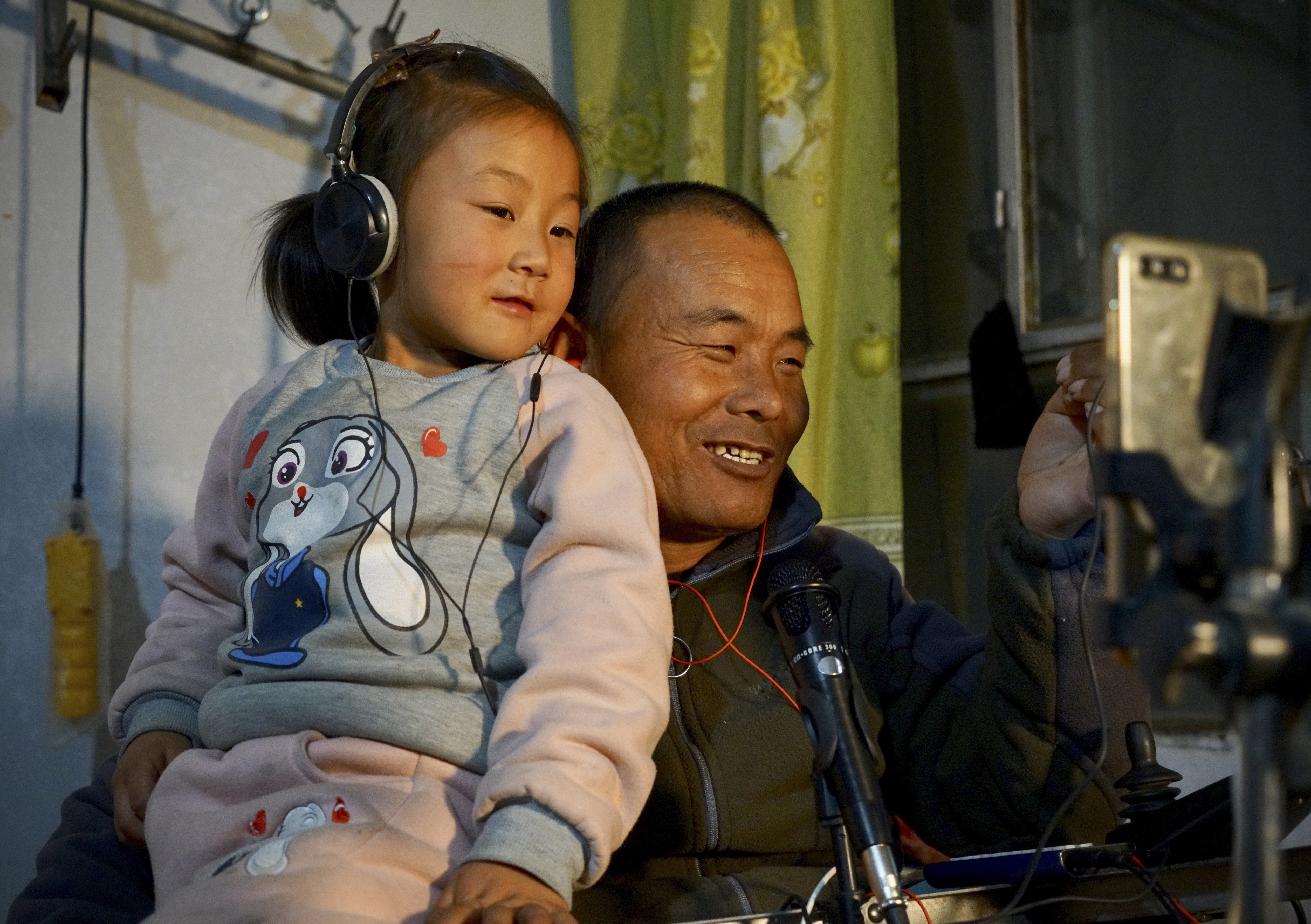 Tian Haicheng (right) and his daughter Jiajia have won legions of fans live-streaming from their home in rural Ningxia. Photo: Tom Wang