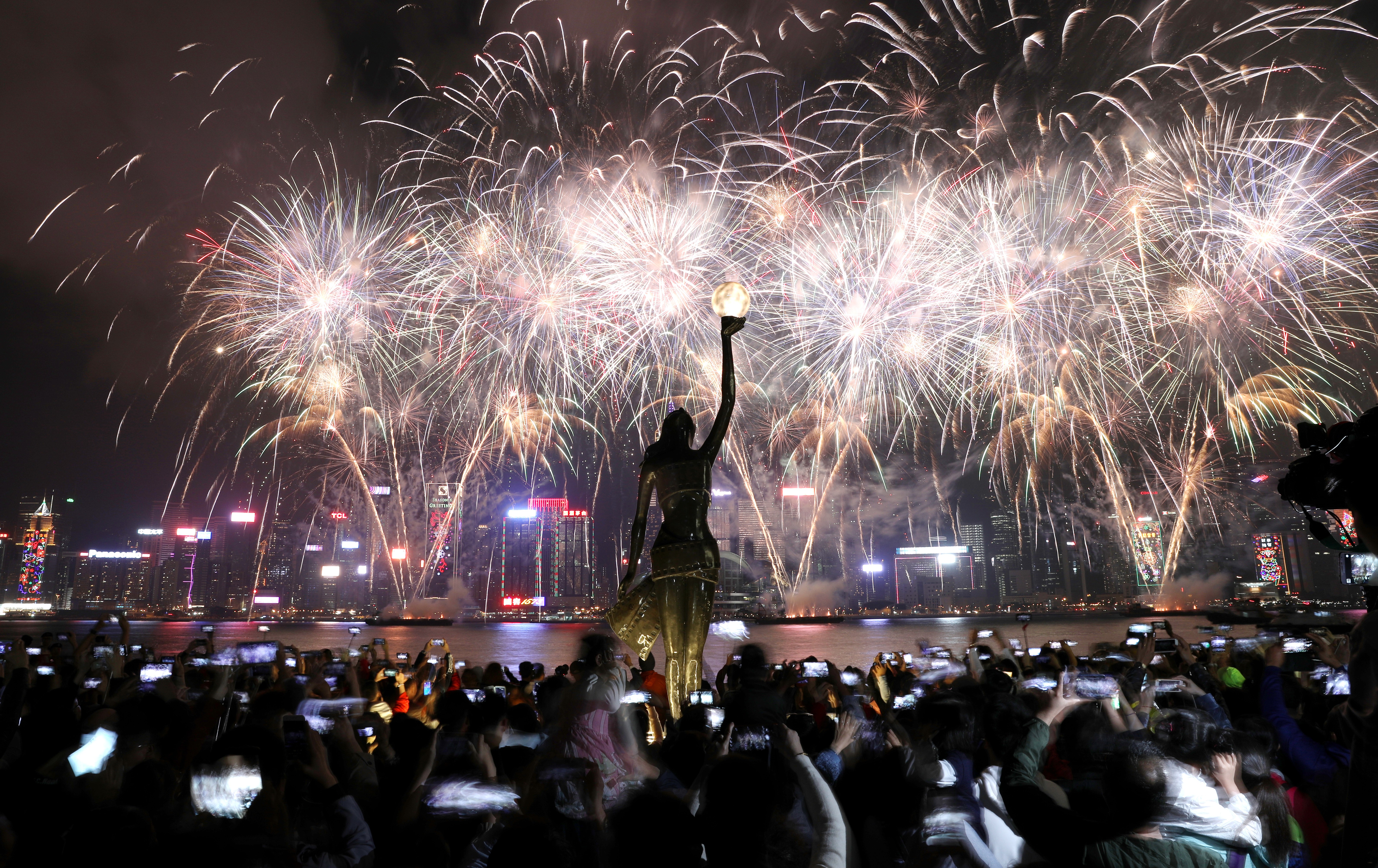 Fireworks light up Victoria Harbour to celebrate Lunar New Year, photographed from the Avenue of Stars. Photo: Nora Tam