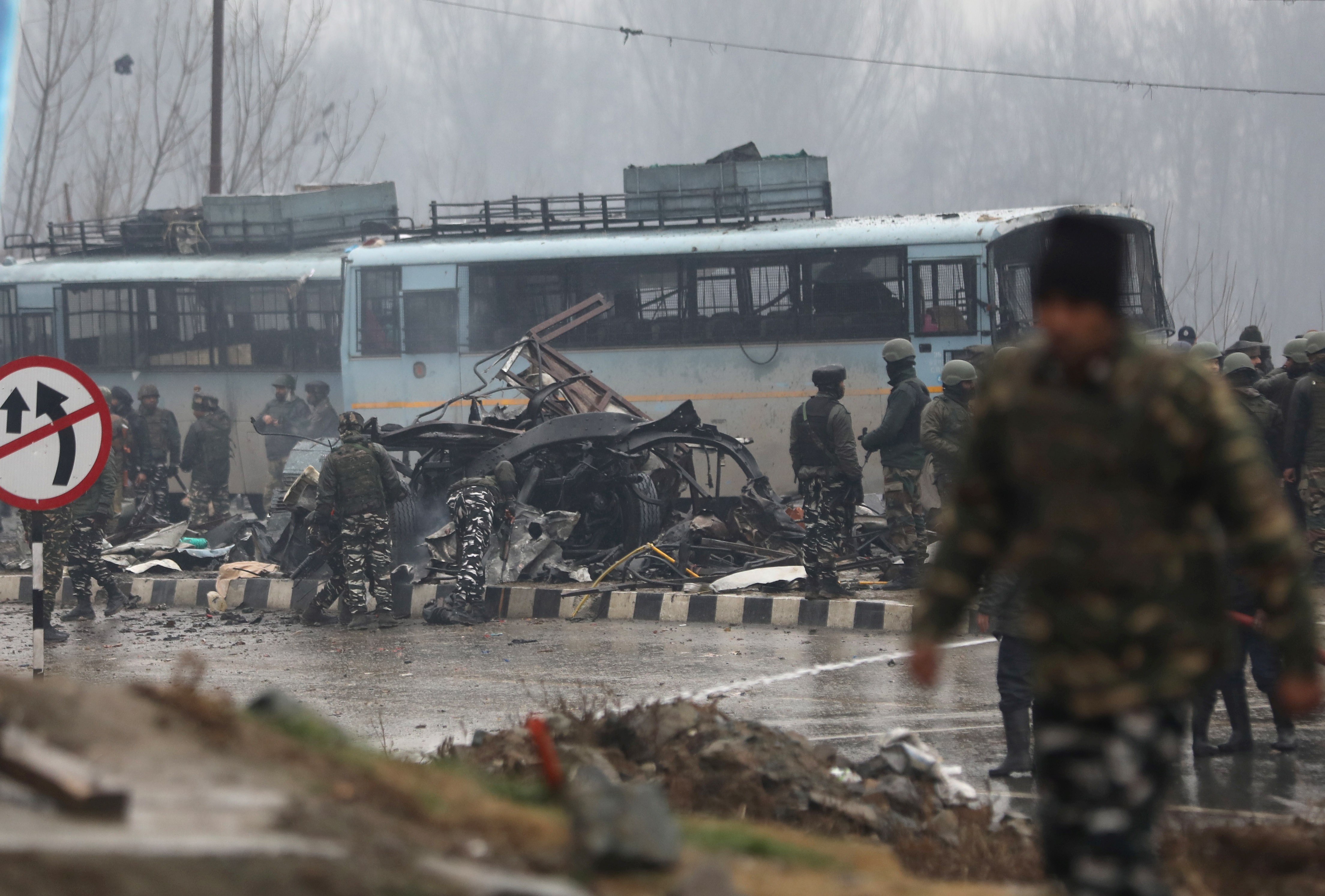 Indian security officers inspect the site of the blast in Jammu and Kashmir’s Pulwama district on Thursday. Photo: EPA-EFE