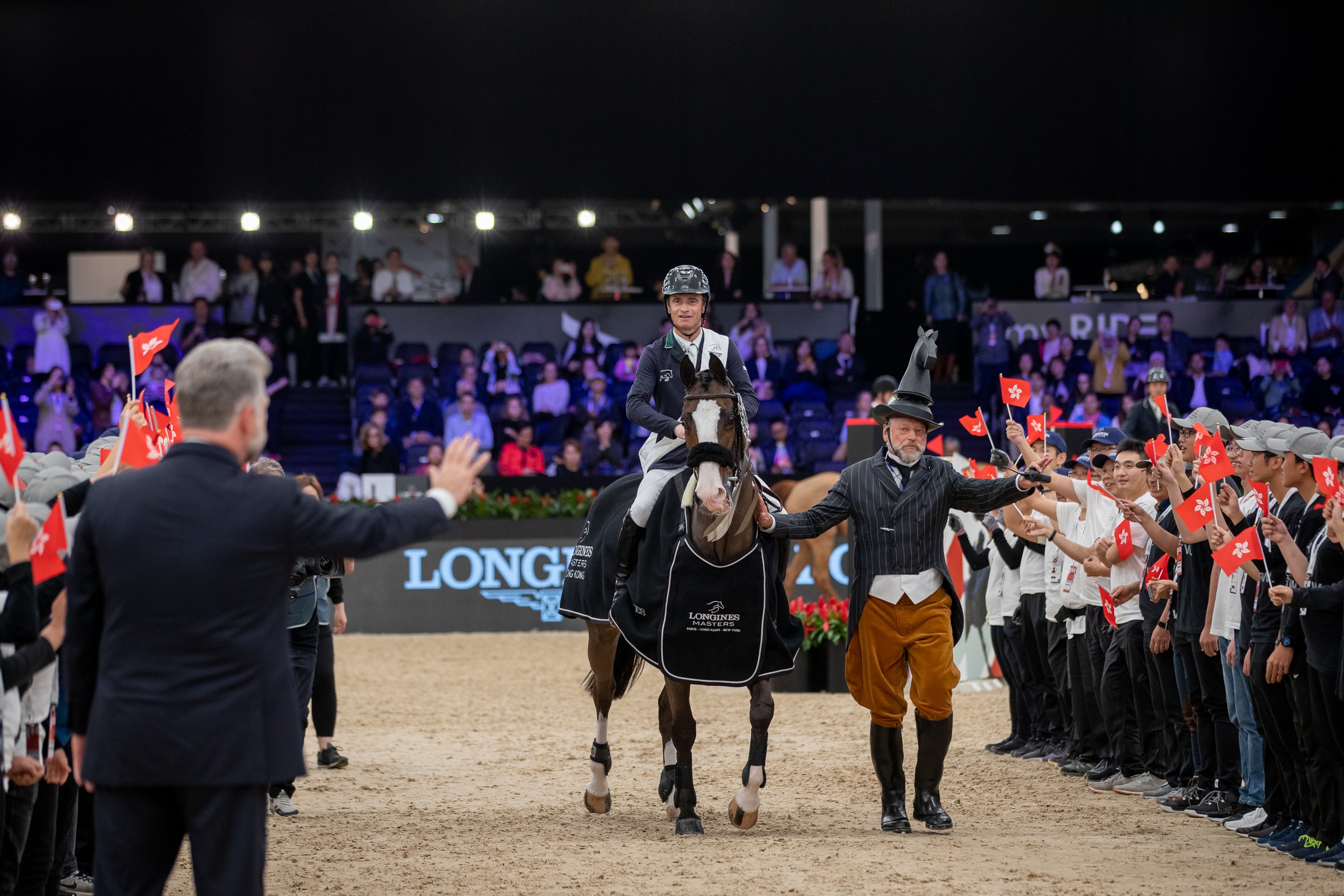 Denis Lynch celebrates his victory with fans at the Longines Grand Prix of Hong Kong. Photo: Jessica Rodrigues