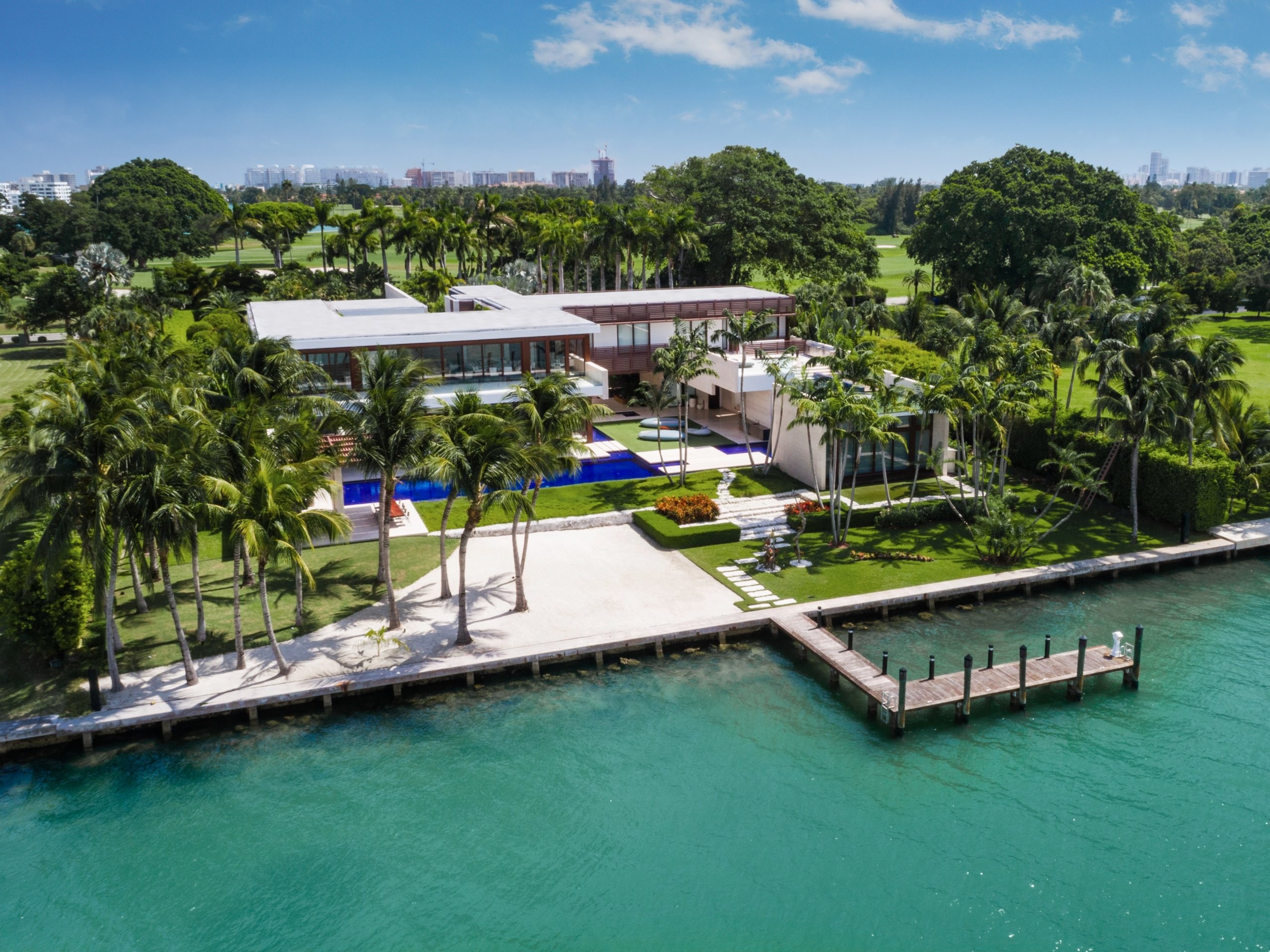 The estate has a 100-foot pool and a beach with pink sand imported from the Bahamas. Photos: The Alexander Team of Douglas Elliman Real Estate