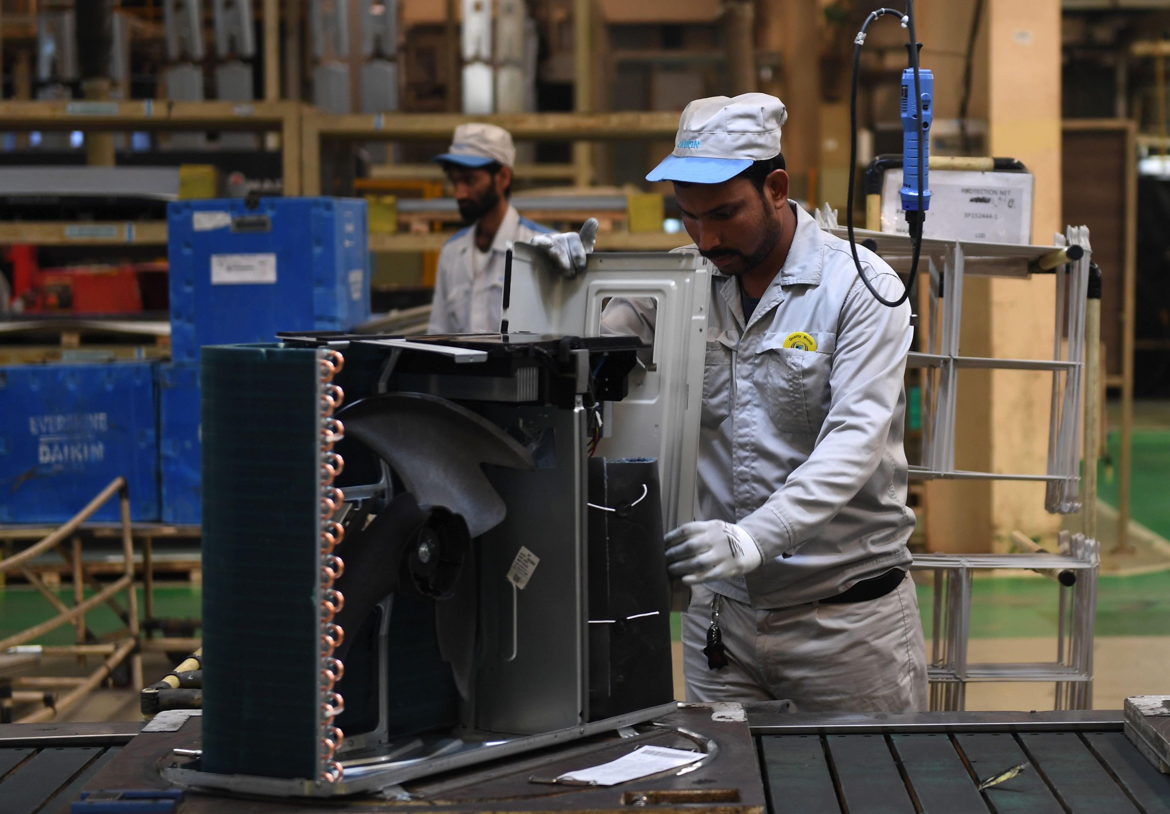 Workers on the production line at the Daikin air-conditioning plant in Neemrana, southwest of New Delhi. According to a Deloitte survey, India is expected to be one of the world’s top five manufacturing nations by 2020. Photo: AFP