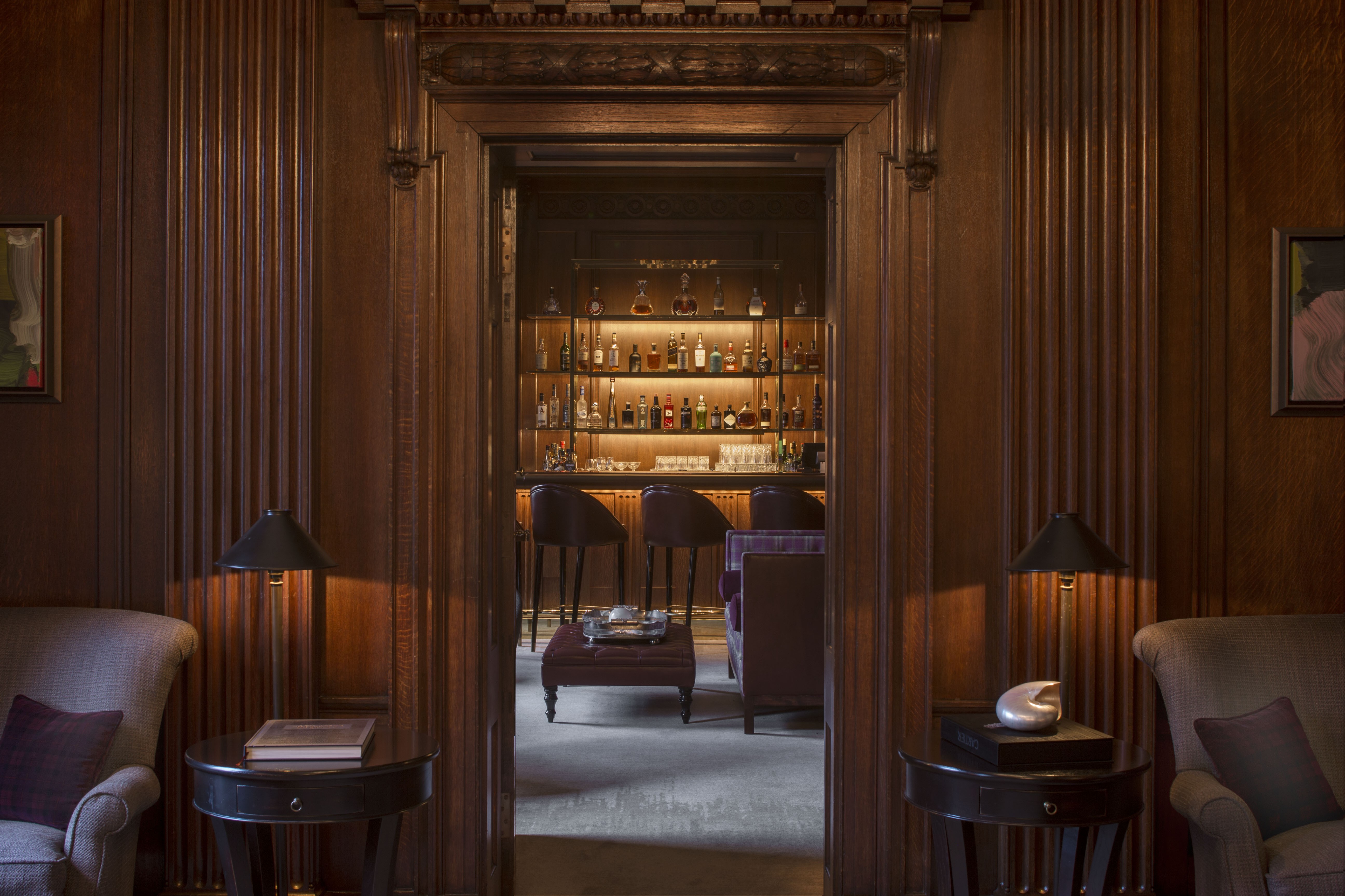 The Club at the Four Seasons London is wood-panelled, with quiet nooks and sofas beside roaring fires.