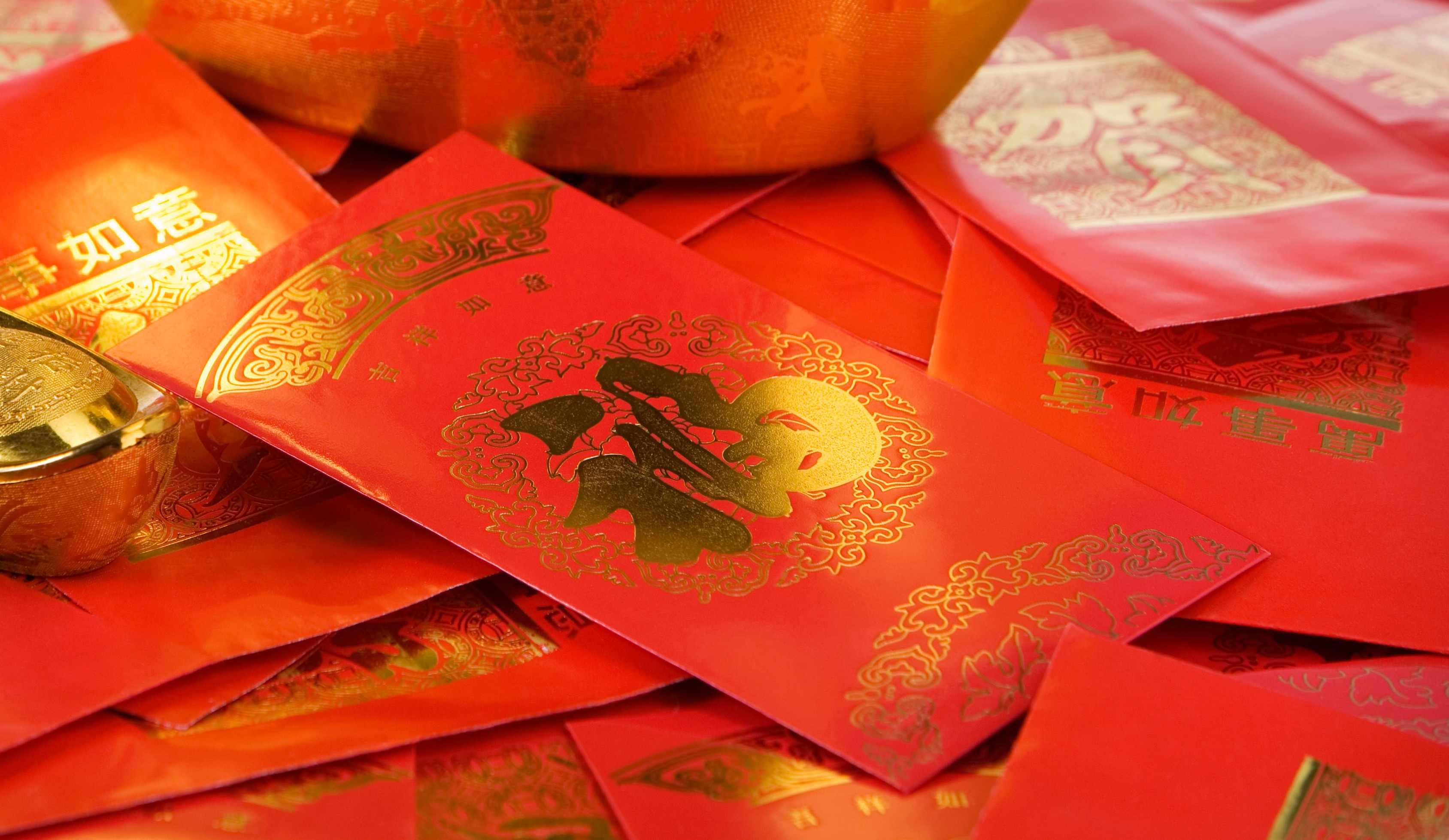 muffled-bat943: a person holding a bunch of red envelopes