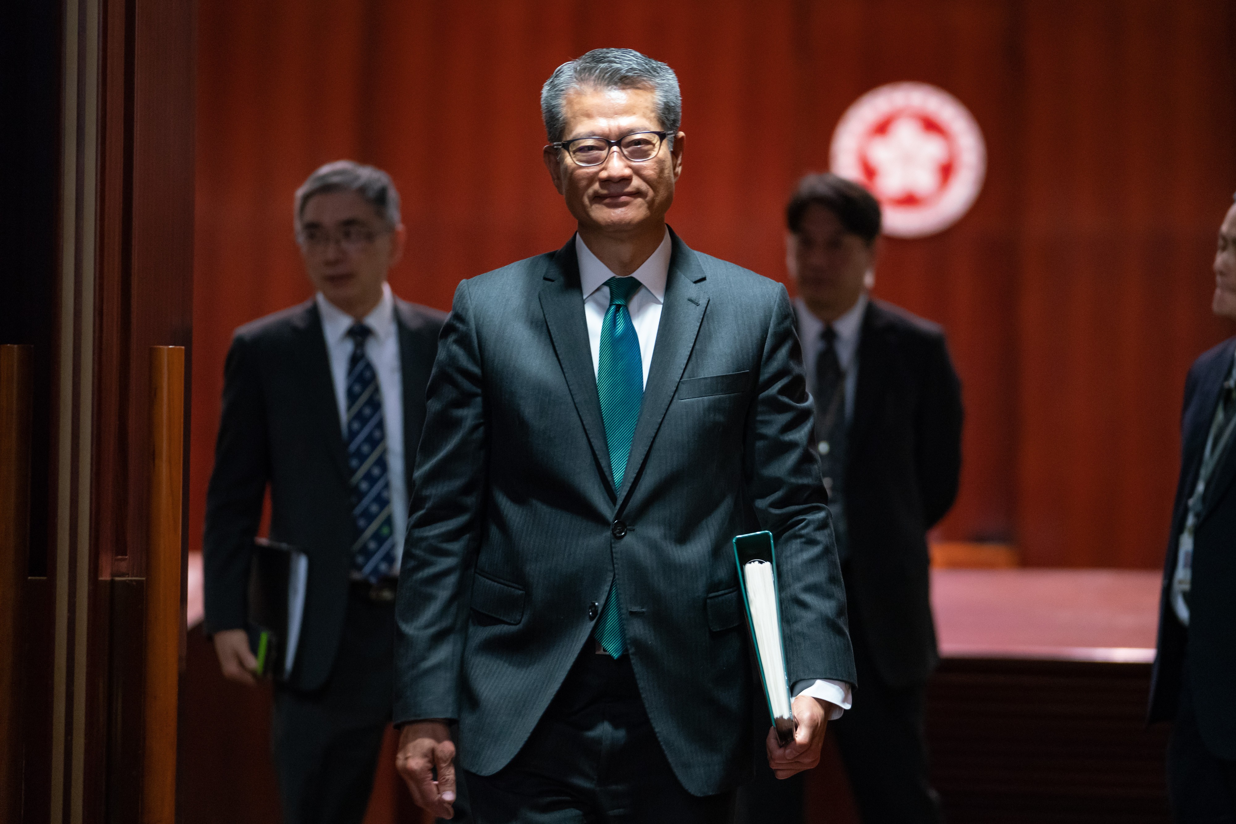 Financial Secretary Paul Chan leaves after delivering his budget speech at the Legislative Council on February 27. Photo: Bloomberg