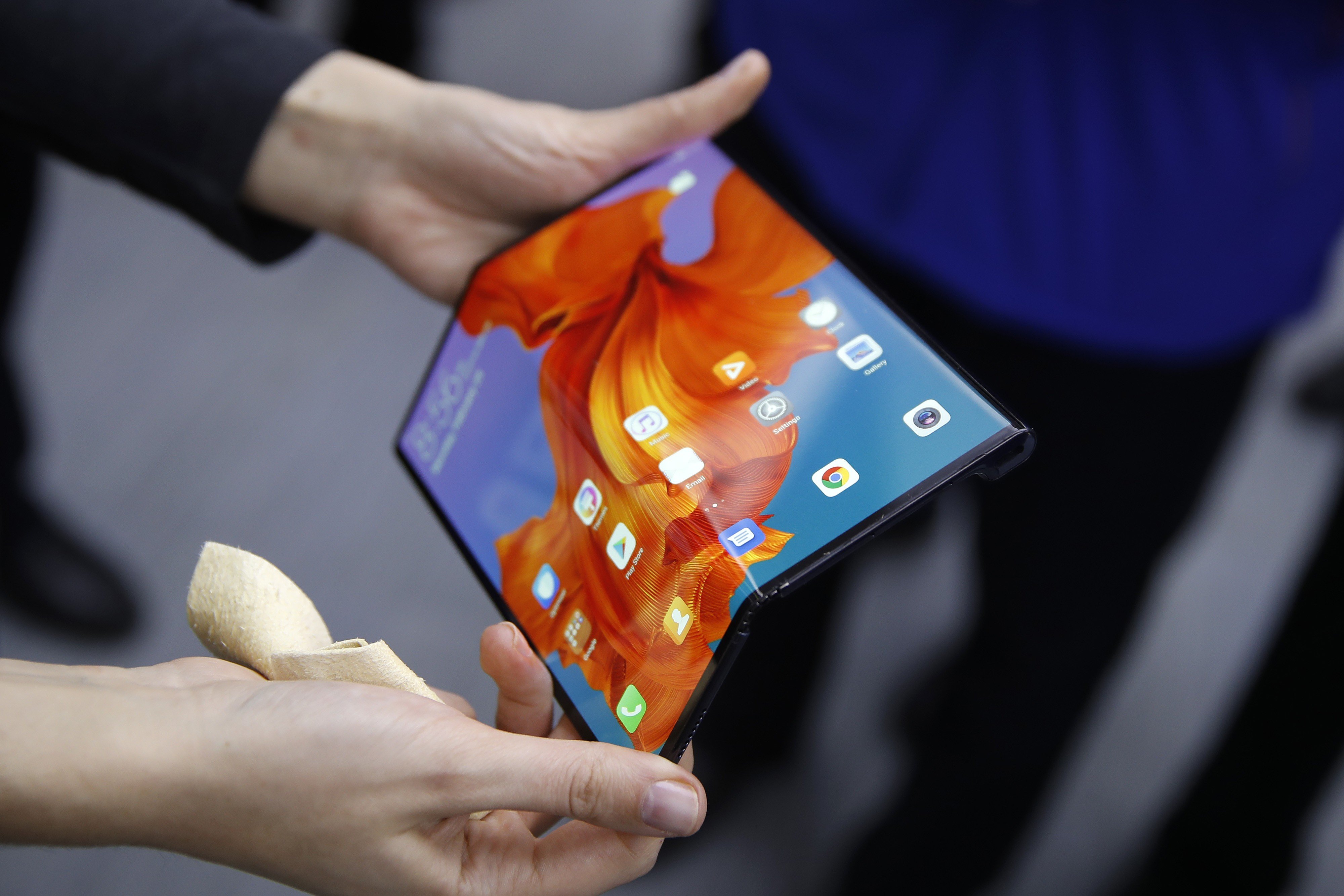 An employee demonstrates a Mate X foldable 5G mobile device at the Huawei Technologies Co. pavilion on the opening day of the MWC Barcelona in Barcelona, Spain. Photo: Bloomberg
