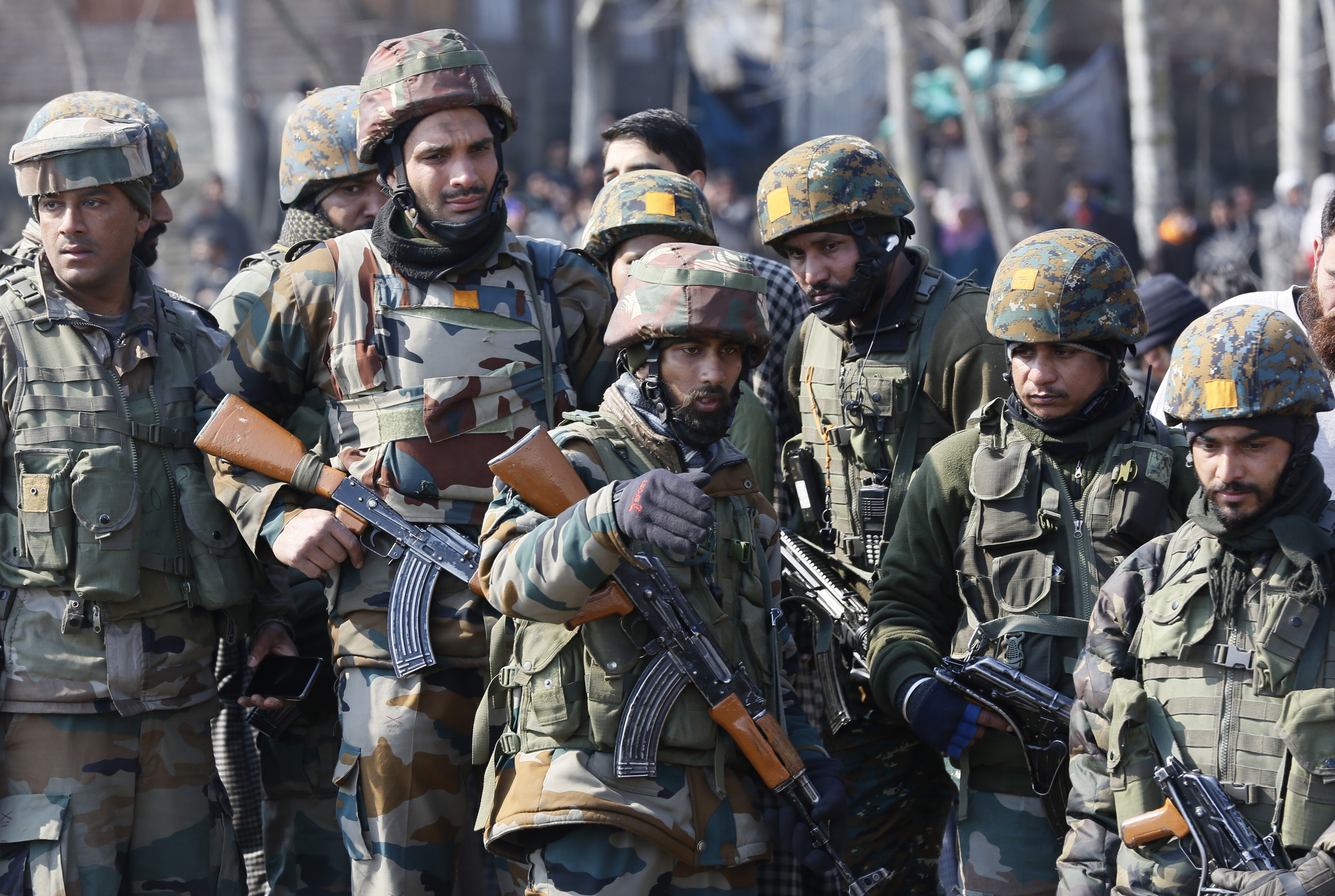 Indian army soldiers near the wreckage of an Indian helicopter. Photo: AP