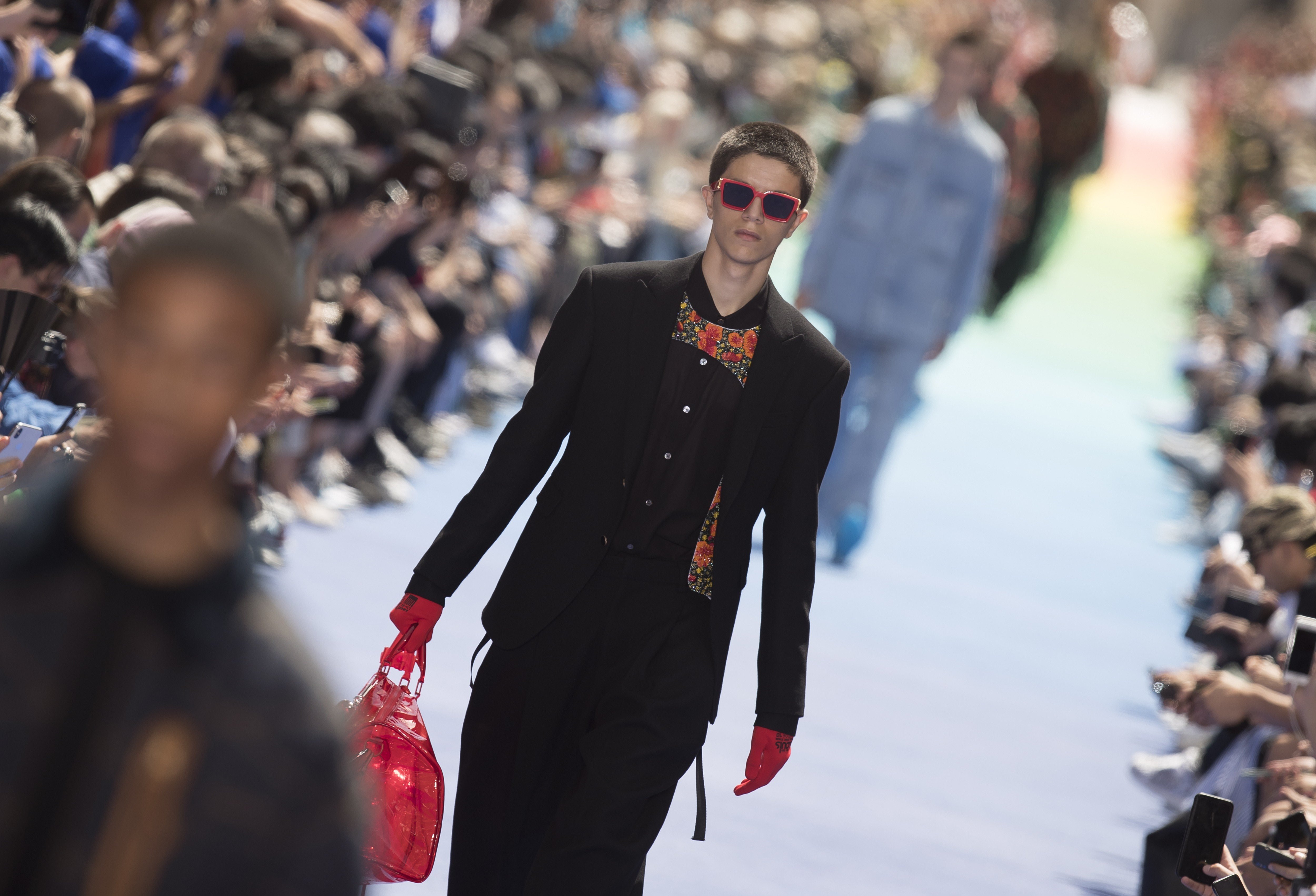 Kris Wu wears sunglasses, outside Vuitton, during Paris Fashion
