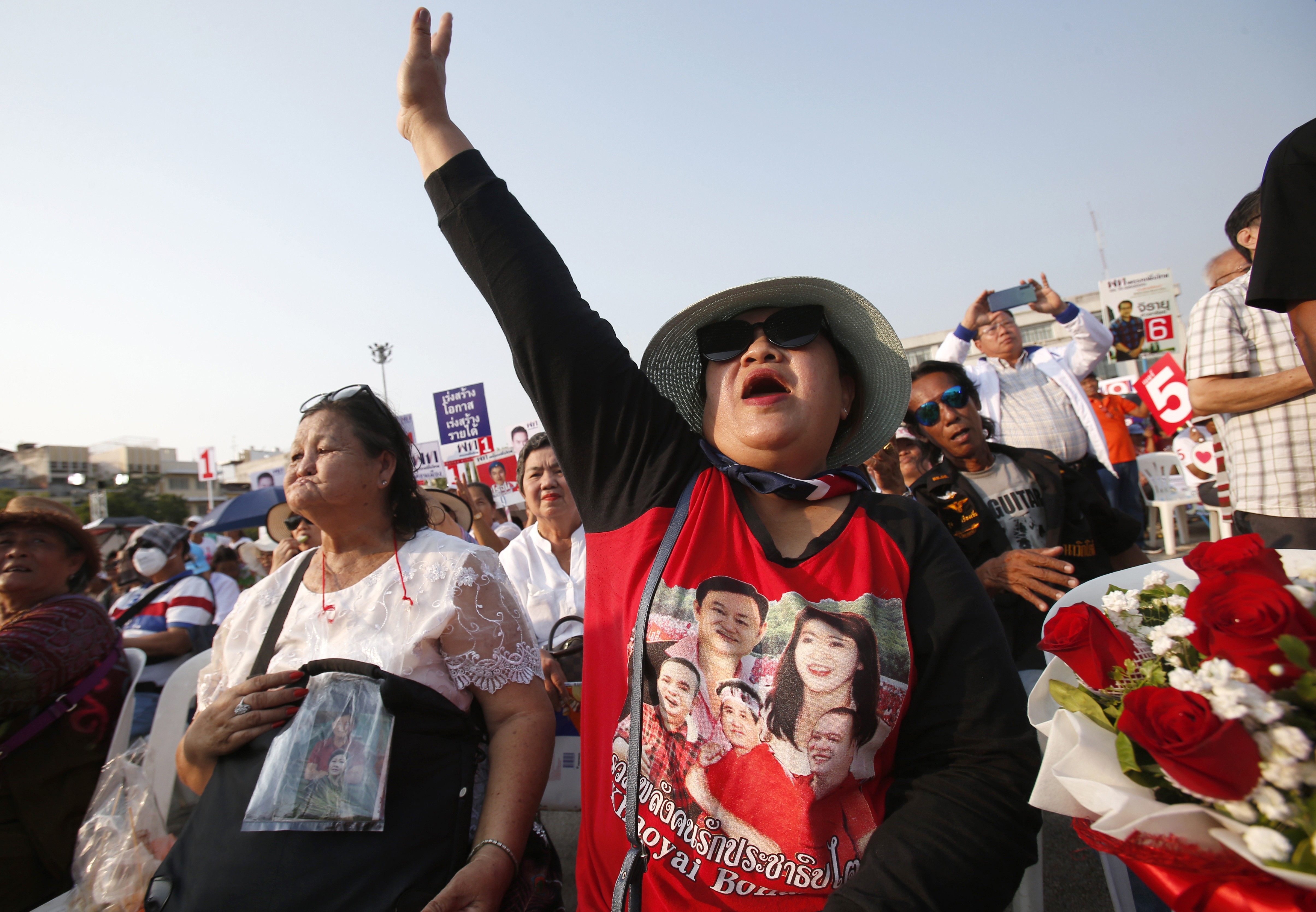 A supporter of Pheu Thai Party wearing a T-shirt of former prime ministers Thaksin Shinawatra and Yingluck Shinawatra. Photo: AP