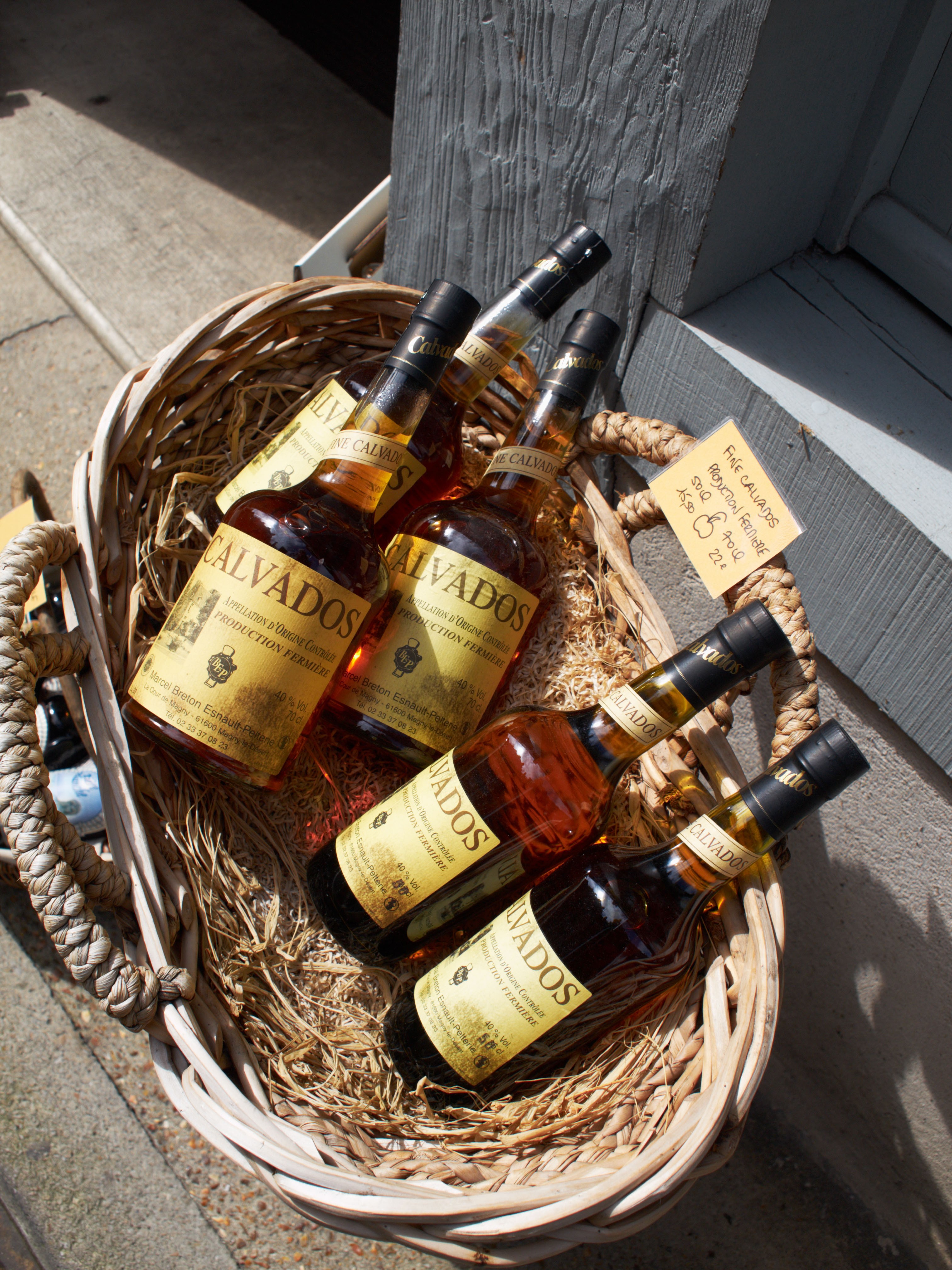 Bottles of calvados for sale in Normandy, France. Photo: Alamy