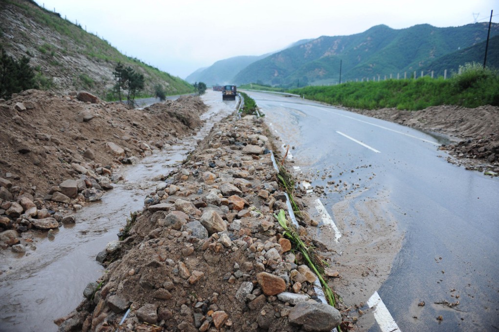 A section of highway damaged by the tropical storm.