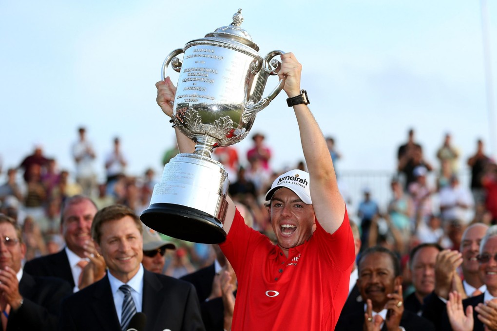 Rory McIlroy holds up his trophy after winning the 94th PGA Championship at the Ocean Course, the longest track ever for a major tournament. Photo: AFP