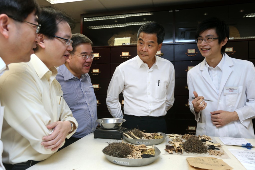 Chief Executive Leung Chun-ying visits a Chinese medicine clinic at the University of Hong Kong. Photo: Sam Tsang