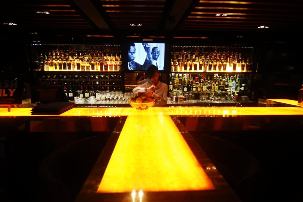 Award-winning mixologist Aubrey Sim spruces up cocktails at B28, a premium whisky and cocktail bar in the basement of The Club Hotel.