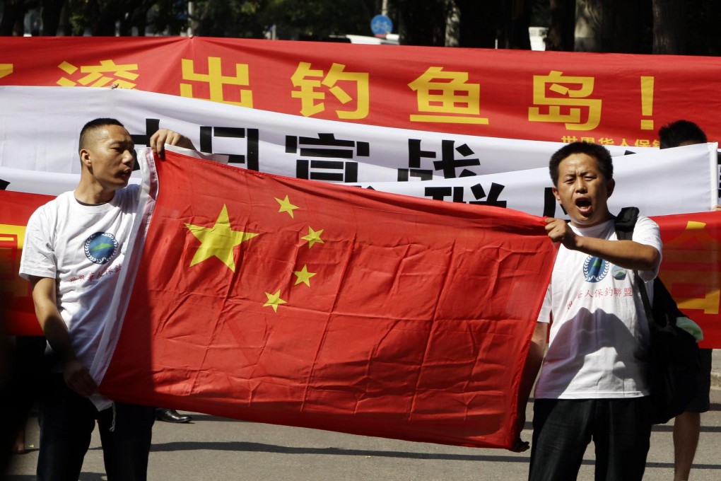 Protesters outside the Japanese embassy in Beijing. Photo: Reuters