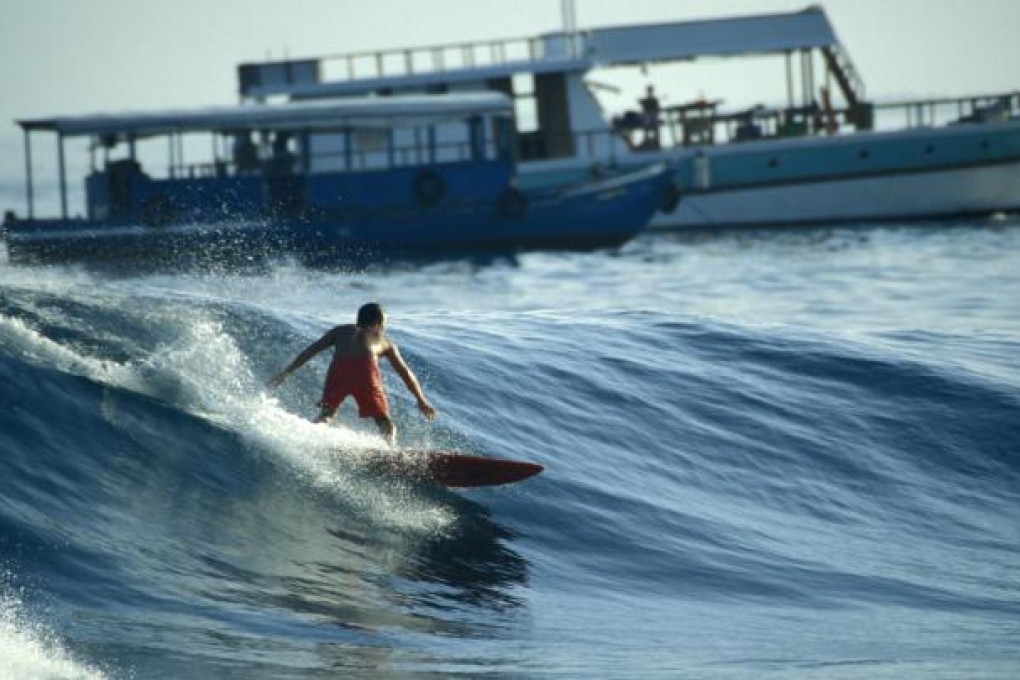 Surfing in style in the Maldives