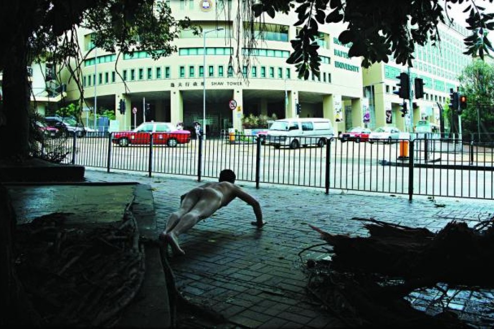 Ou Zhihang does his thing across the street from the Baptist University's Shaw Tower. Photo: Ou Zhihang