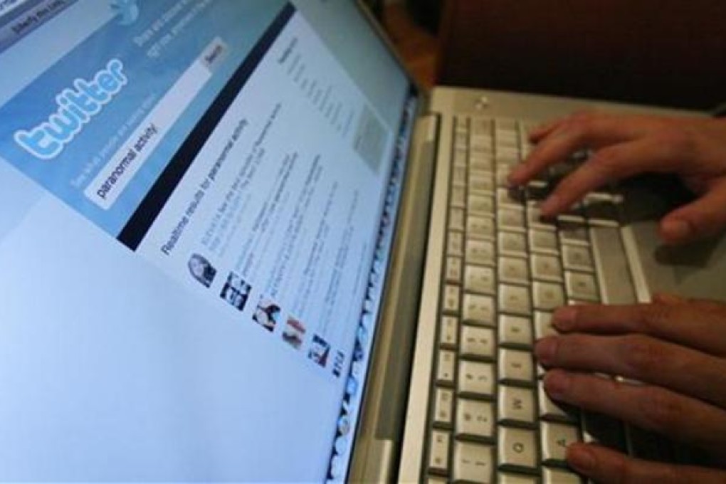 A Twitter page is displayed on a laptop computer in Los Angeles October 13, 2009. REUTERS/Mario Anzuoni